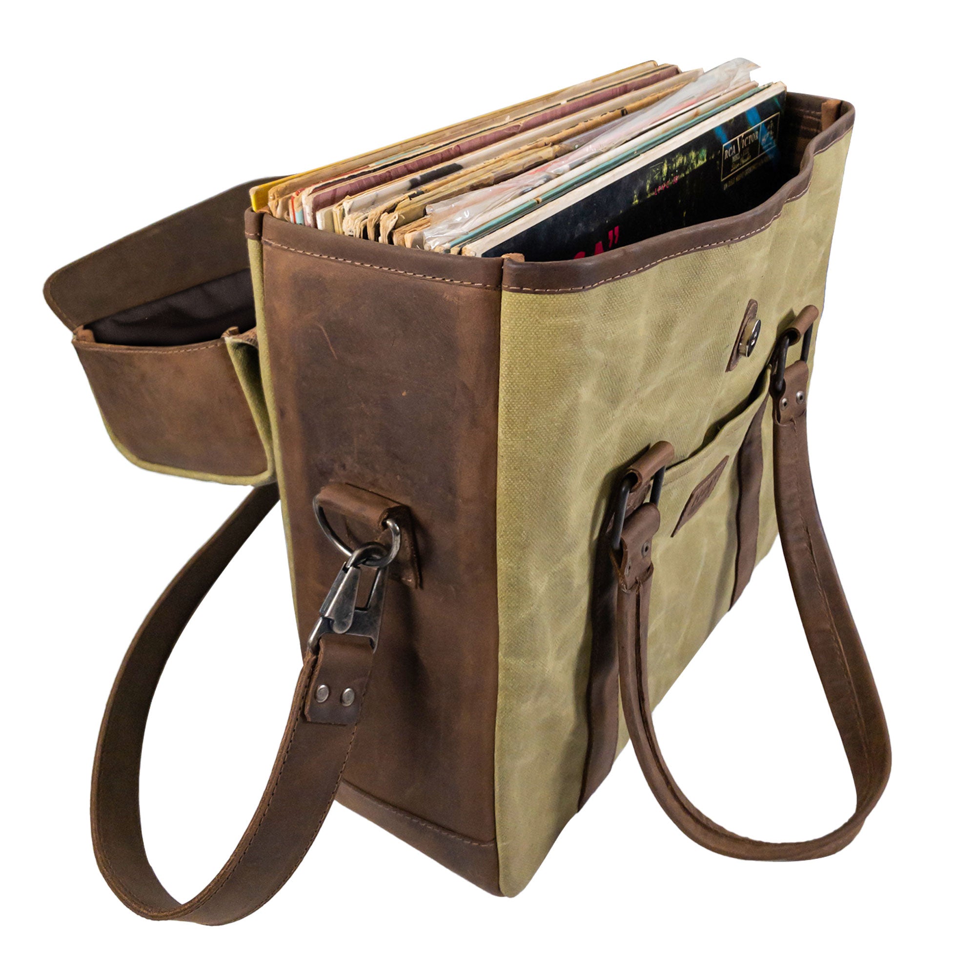 Open view of the Vinyl Records Messenger Bag by Hide & Drink, featuring vinyl records inside. This bag is designed for DJs and musicians, showcasing the blend of waxed canvas and full grain leather, representing small batch production and artisan quality from La Antigua Guatemala & Oaxaca Mexico.
