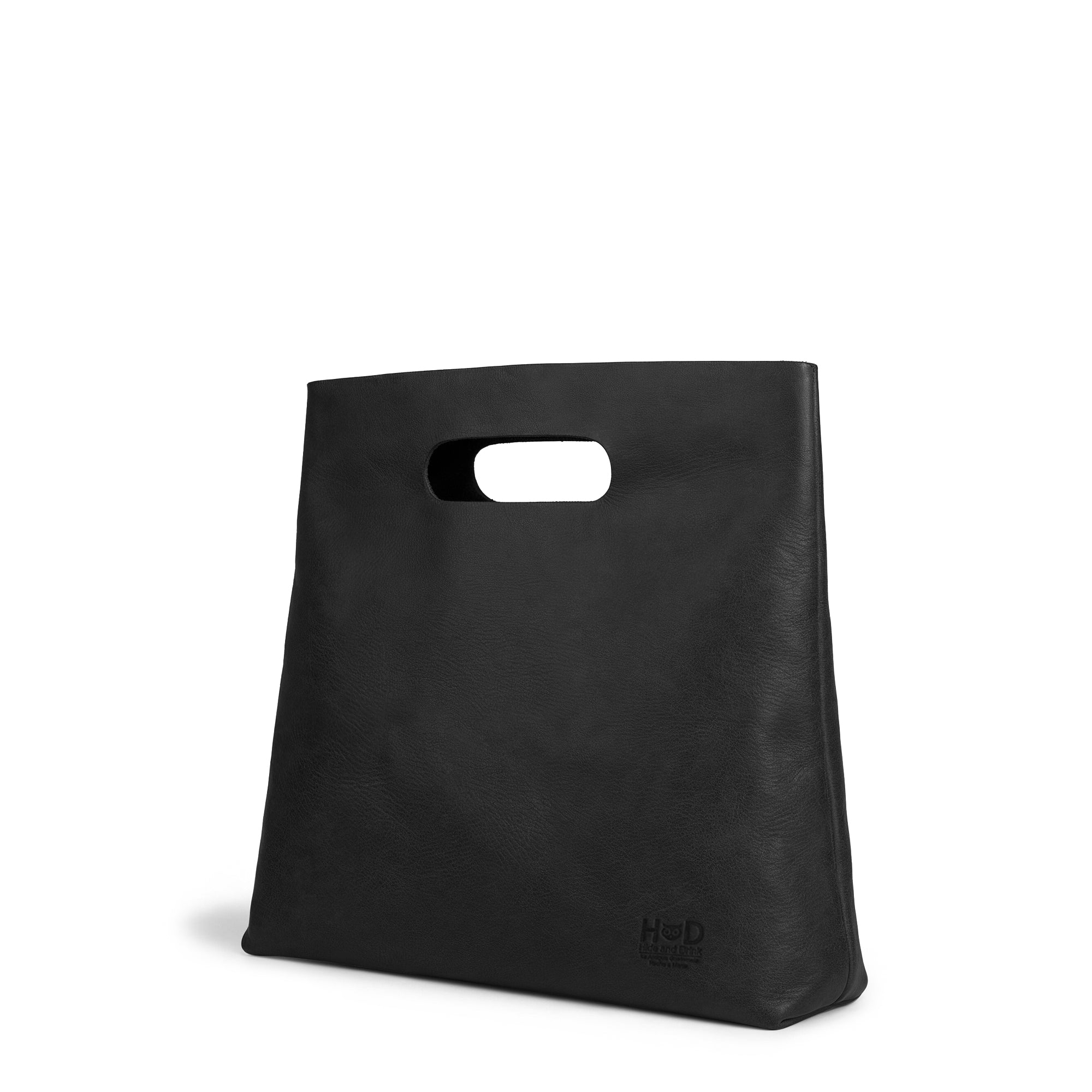 Side view of the Hide & Drink Minimalist Boho Handbag in black leather, showcasing its unique design. This artisan handcrafted rustic purse is made from high-quality Full Grain Leather in La Antigua Guatemala & Oaxaca Mexico.