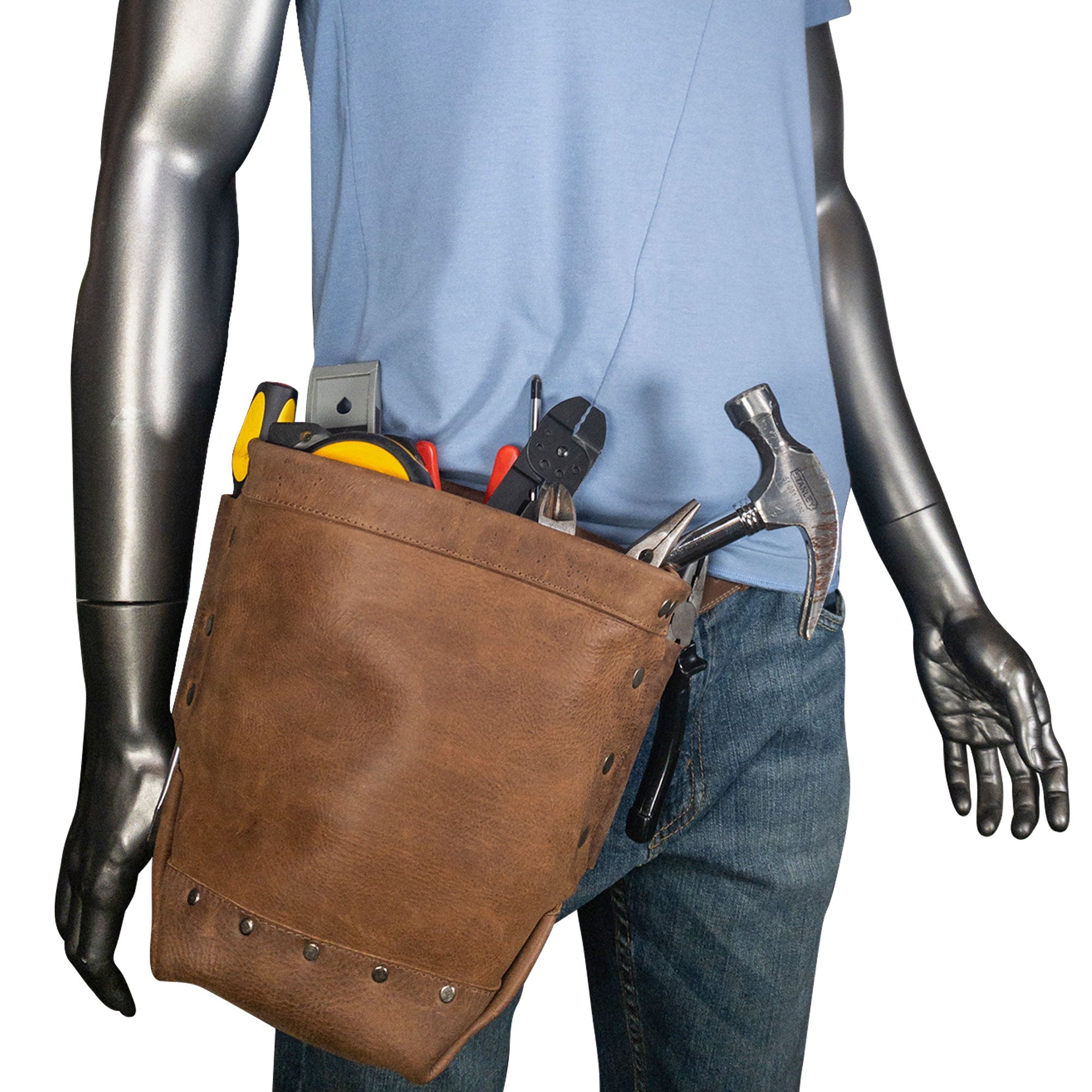 Hide & Drink Electrician Tool Pouch worn by a mannequin, highlighting its practicality and ease of use. This classic holder, made from full grain leather, serves as a heavy duty tool pouch for electricians. Artisan-crafted through small batch production and fire branded, it reflects quality craftsmanship, handmade in La Antigua Guatemala & Oaxaca Mexico.
