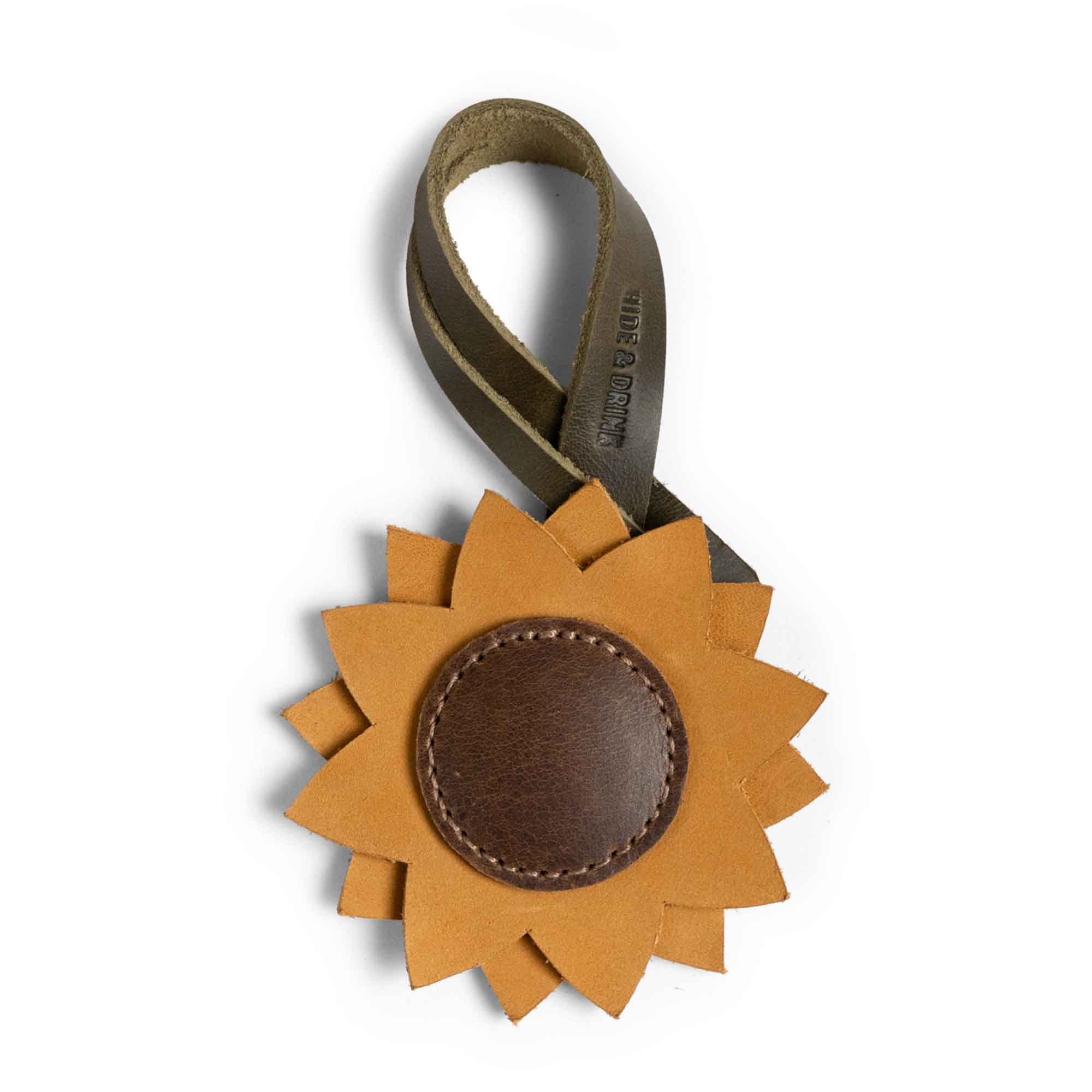 Hide & Drink Bag Charms featuring a sunflower design, ideal charm for handbags and purse charm for tote & backpacks. Crafted from full grain leather, these ornaments for women deliver a unique charm, embodying StockyardX's small batch production, hand cut, and hand sewn techniques. Fire branded craftsmanship highlights its artisan quality, handmade in La Antigua Guatemala & Oaxaca Mexico.