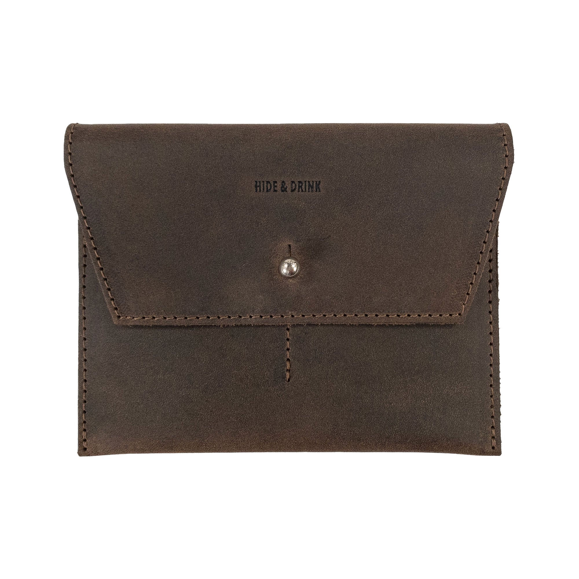 Hide & Drink Minimalist Wallet, a durable cash organizer crafted from full grain leather, featuring a secure snap closure. Ideal for keeping cards and cash organized, this artisan wallet showcases small batch production and exquisite hand cut and hand sewn details, made by artisans in La Antigua Guatemala & Oaxaca Mexico.