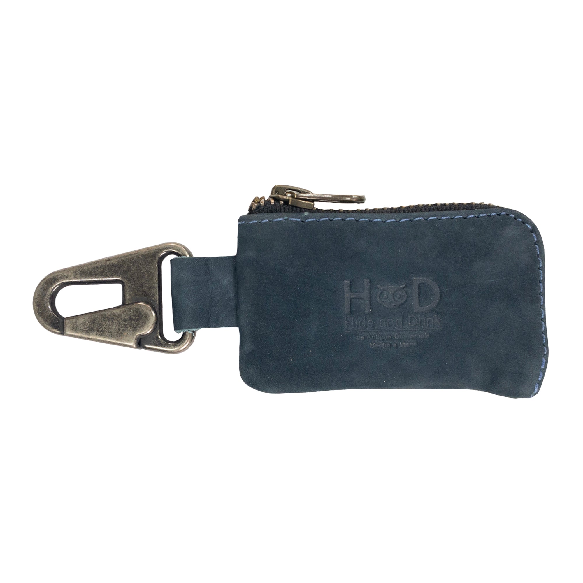 Close-up of the Car Key Holder by Hide & Drink, featuring a durable full grain leather exterior and nickel metal clasp. This handmade item is ideal for holding keys, headphones, memory cards, flash drives, and cash. Artisan creation from La Antigua Guatemala & Oaxaca Mexico.