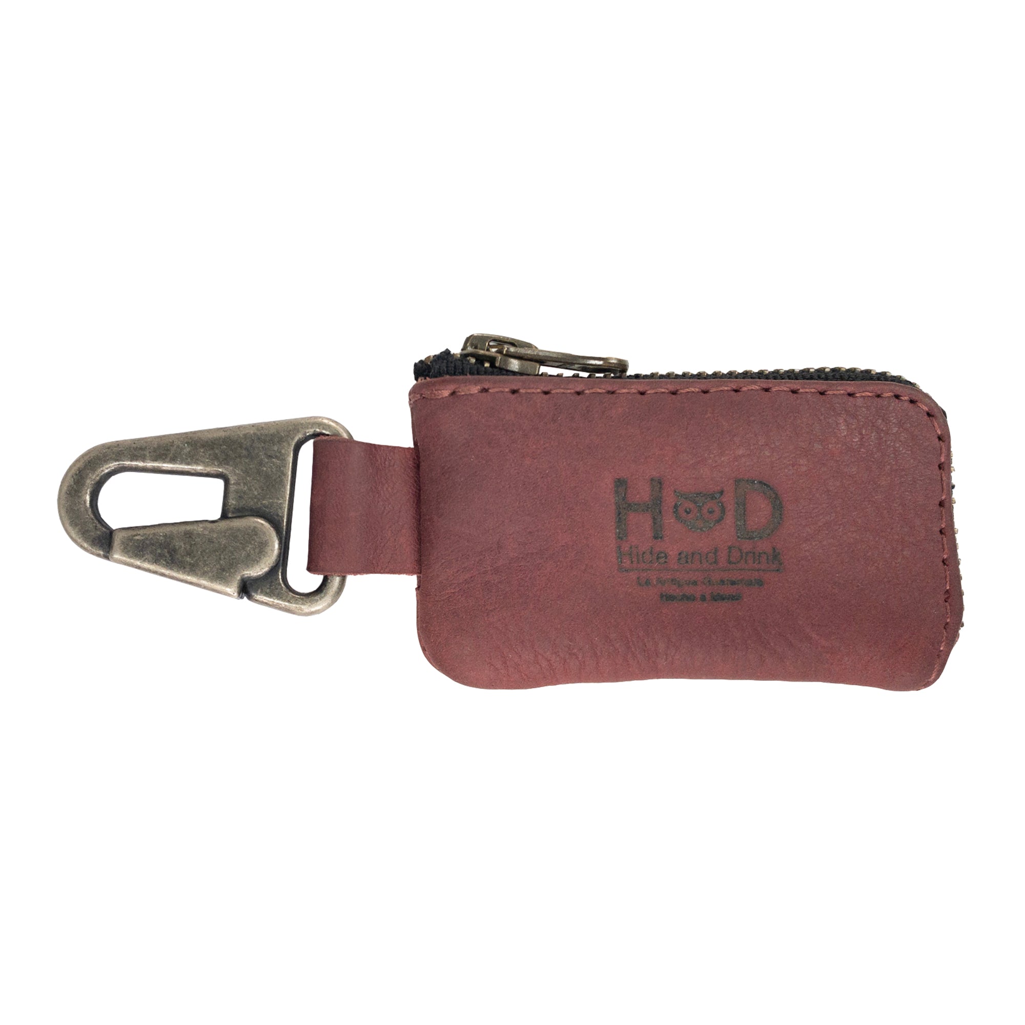 Stylish Car Key Holder by Hide & Drink - a chic accessory for keeping keys secure, designed to hold Headphone and charging Cables, Memory Cards, Flash Drives, and Cash. Features a Nickel Metal Clasp, made from Full Grain Leather, perfect for those who appreciate Small Batch Production and Artisan, Handmade products crafted in La Antigua Guatemala & Oaxaca Mexico.