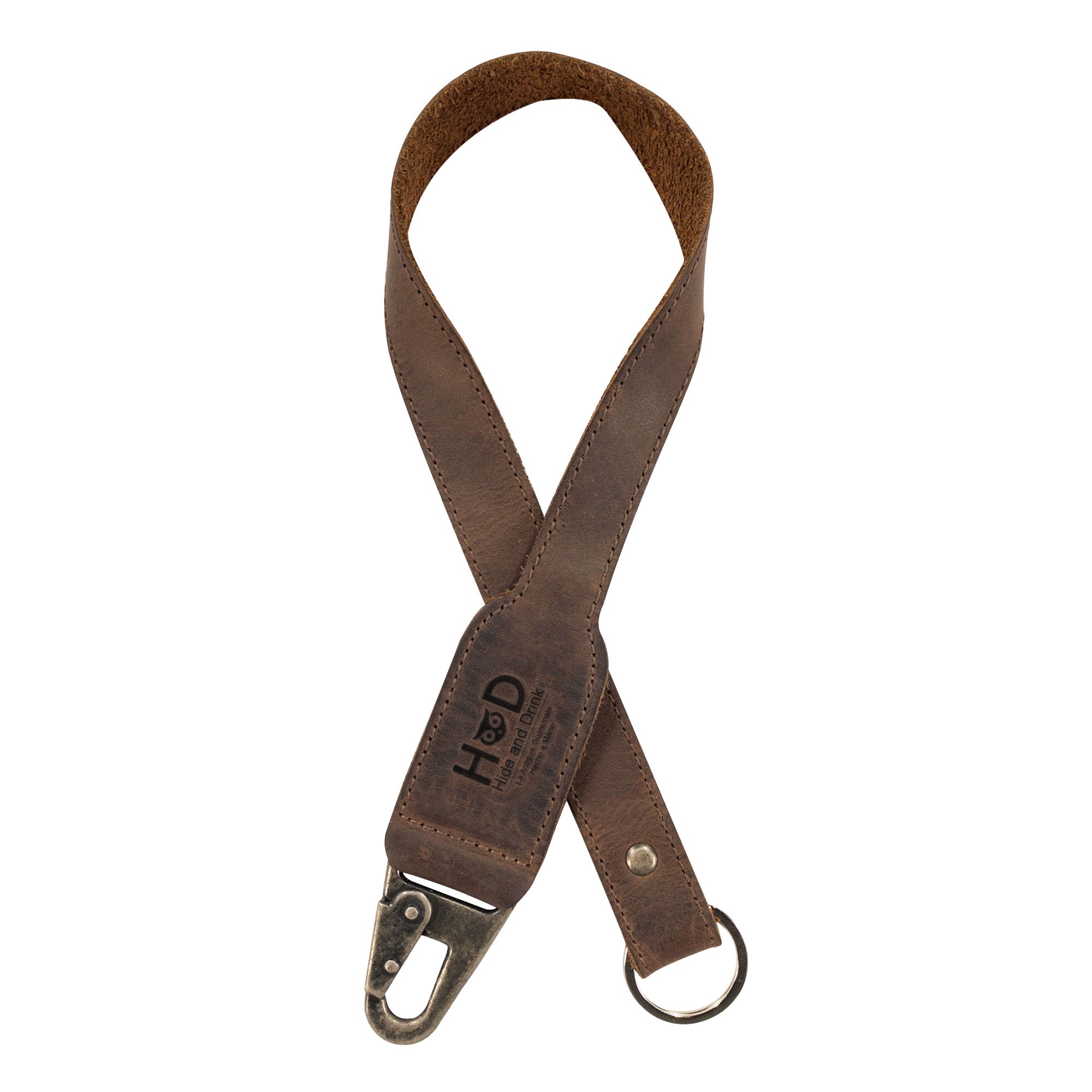 Hide & Drink Keychain Lanyard, a stylish accessory made of Full Grain Leather, featuring a clip to attach to house, car, and apartment keys. This artisan-crafted lanyard showcases small batch production, hand cut and hand sewn details, ideal for keeping your keys accessible.