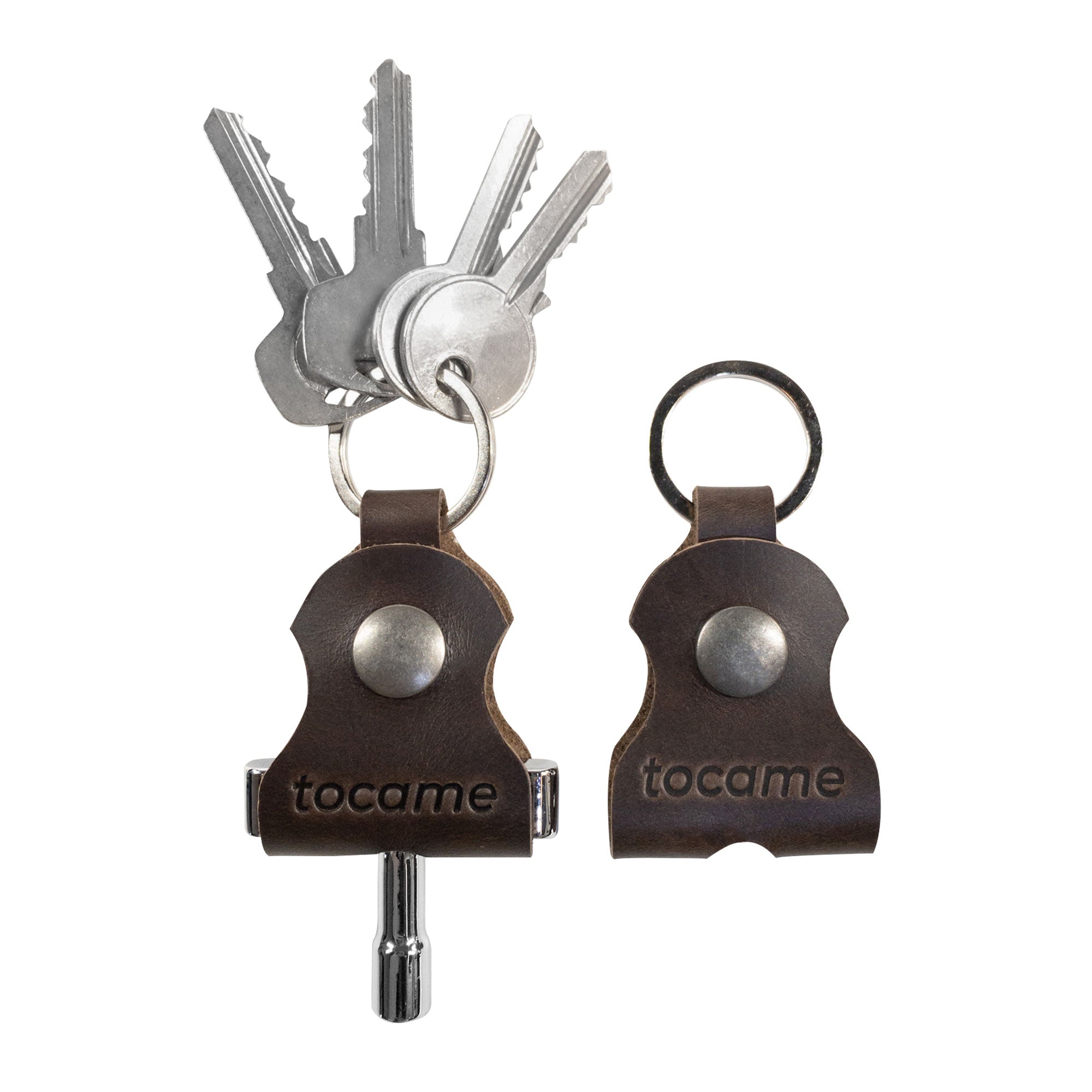 A pair of unique keychains from tocame, part of the Set of 2 Keychains for Drum Tunners (Not Included). These key organizers feature a classic keyring design, perfect for musicians. Made from durable full grain leather, these artisan keychains showcase small batch production craftsmanship, hand cut and hand sewn in La Antigua Guatemala & Oaxaca Mexico.