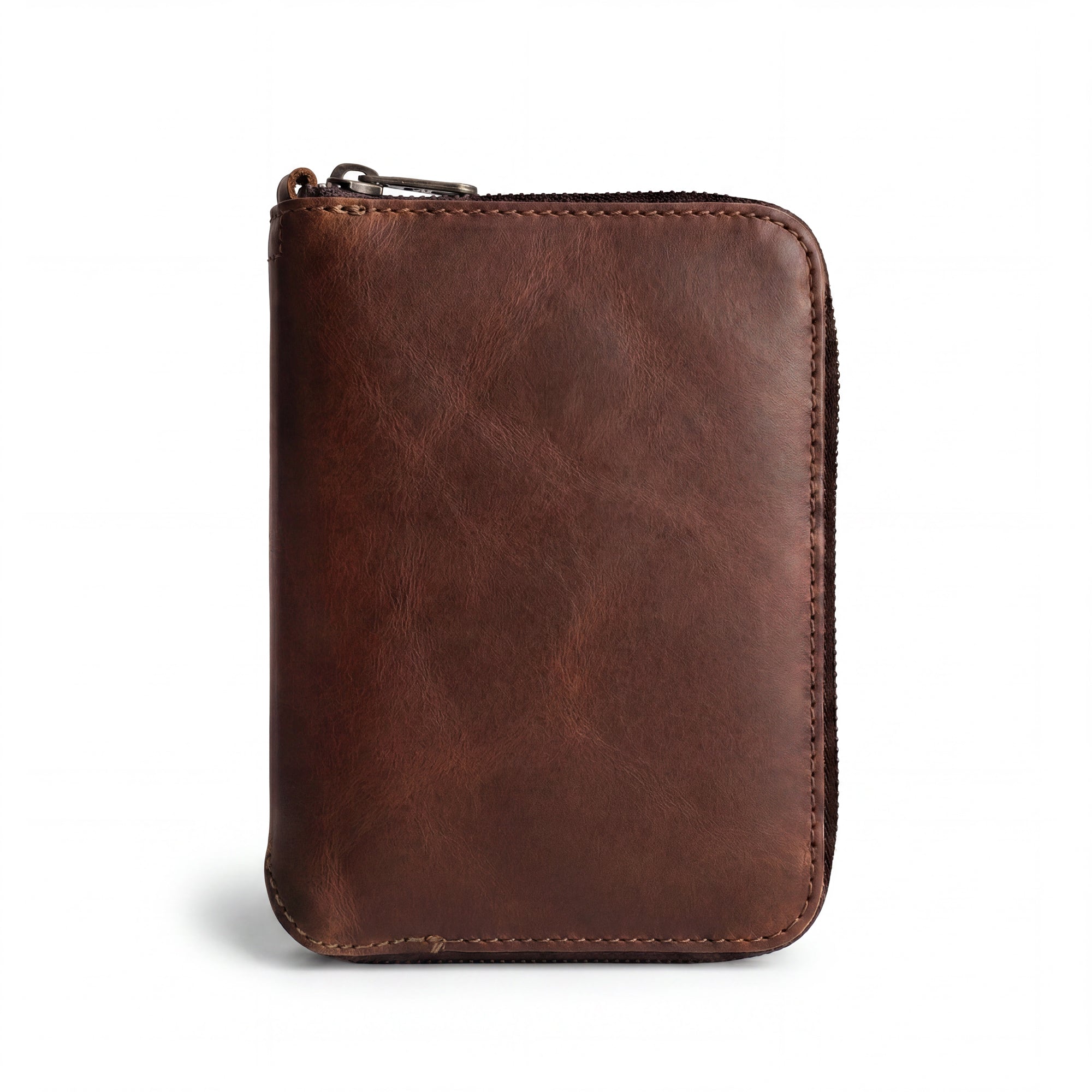 Front view of the Zippered Passport Wallet by Hide & Drink showcasing its rich, brown Full Grain Leather, perfect for stylish travel. Zippered Passport Wallet Handmade from Full Grain Leather - Storage Case for Identification, Credit Cards, Cash Full Grain Leather, StockyardX, Small Batch Production, Hand Cut, Hand Sewn, Fire Branded, Artisan, Handmade in La Antigua Guatemala & Oaxaca Mexico.