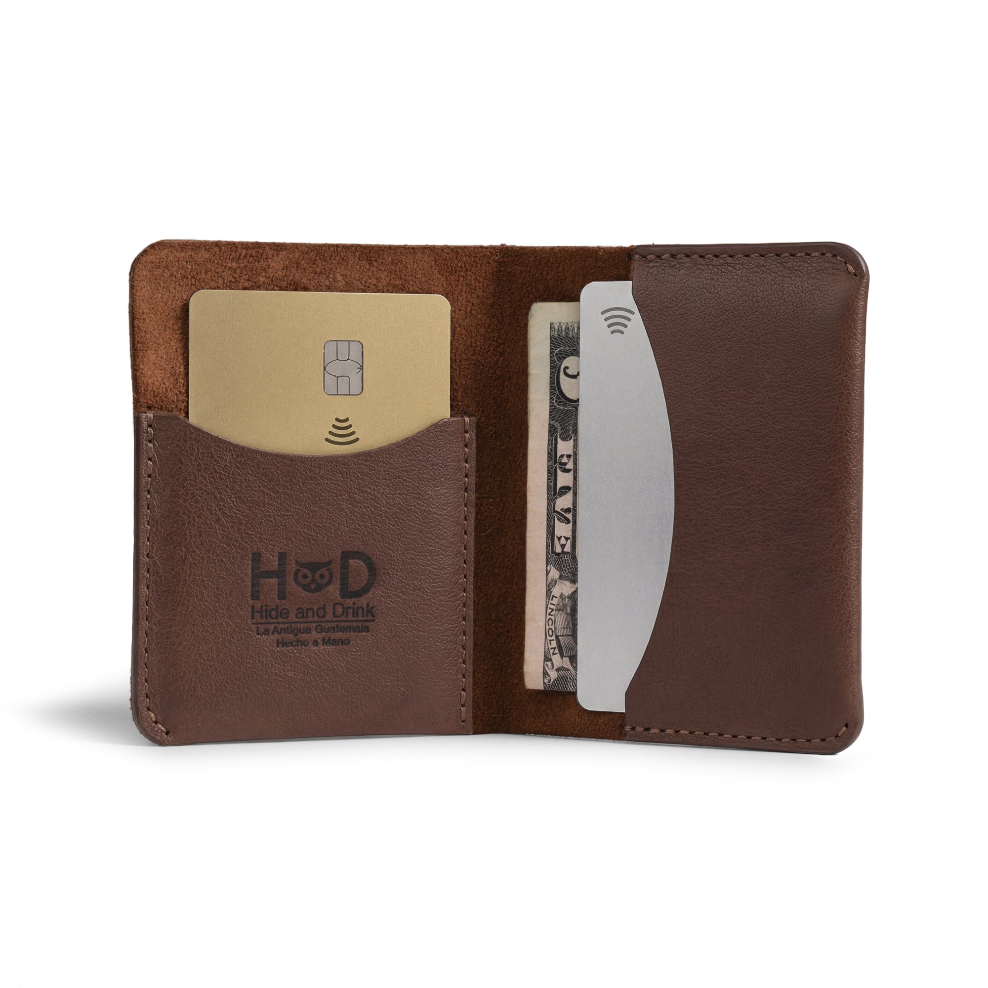 Hide & Drink's Bifold Slim Card Holder features a sleek design for credit card storage and cash organization. Made from full grain leather, this minimalist wallet is hand cut and hand sewn, a perfect choice for those who appreciate artisan craftsmanship. Ideal for everyday use, it's a practical cash case that embodies small batch production and artisan quality from La Antigua Guatemala.