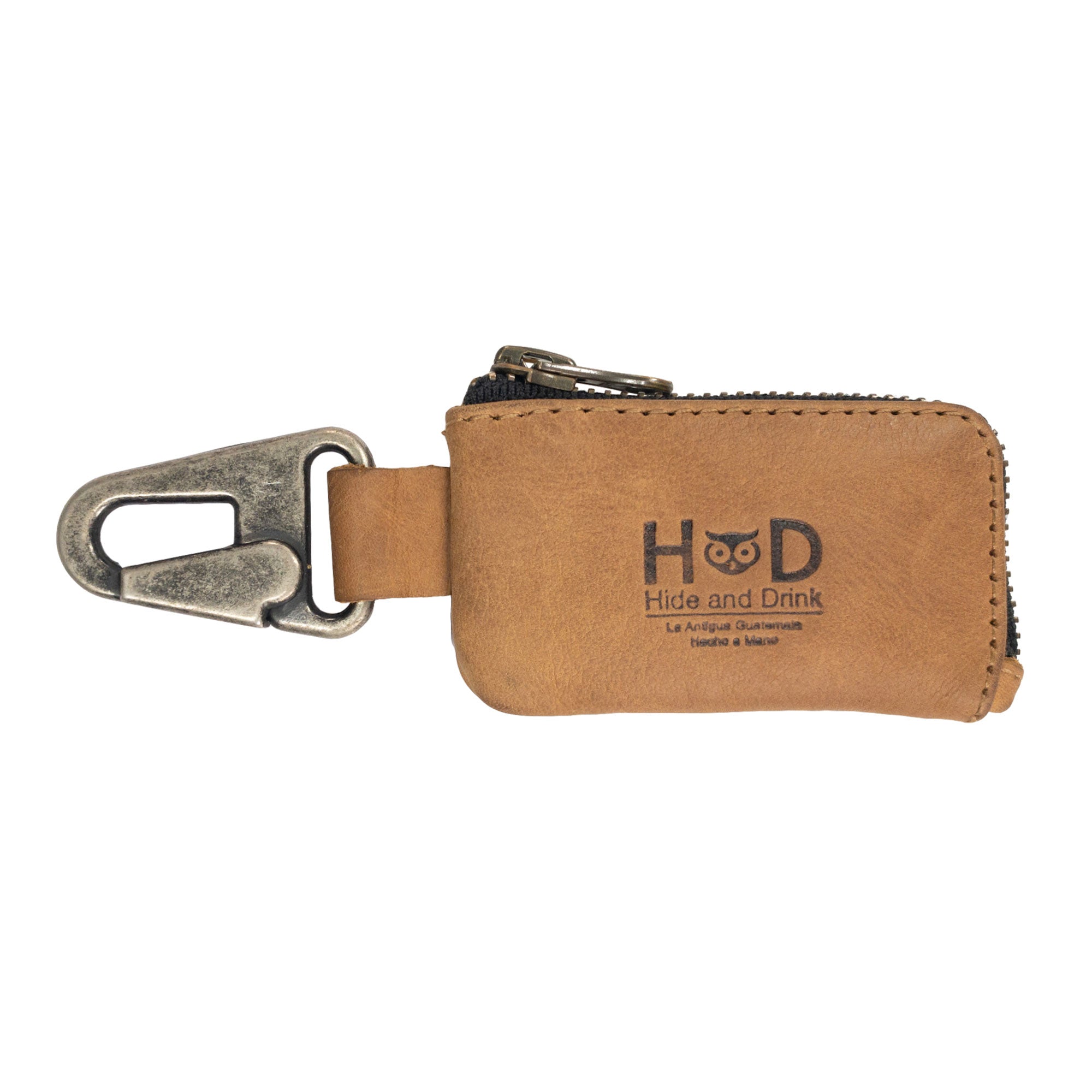 Sleek Car Key Holder by Hide & Drink, designed for organizing keys and cash while effortlessly serving as a case for Headphone and charging Cables, Memory Cards, and Flash Drives. Crafted from sturdy Full Grain Leather and featuring a Nickel Metal Clasp, representing artisan craftsmanship from Small Batch Production in La Antigua Guatemala & Oaxaca Mexico.