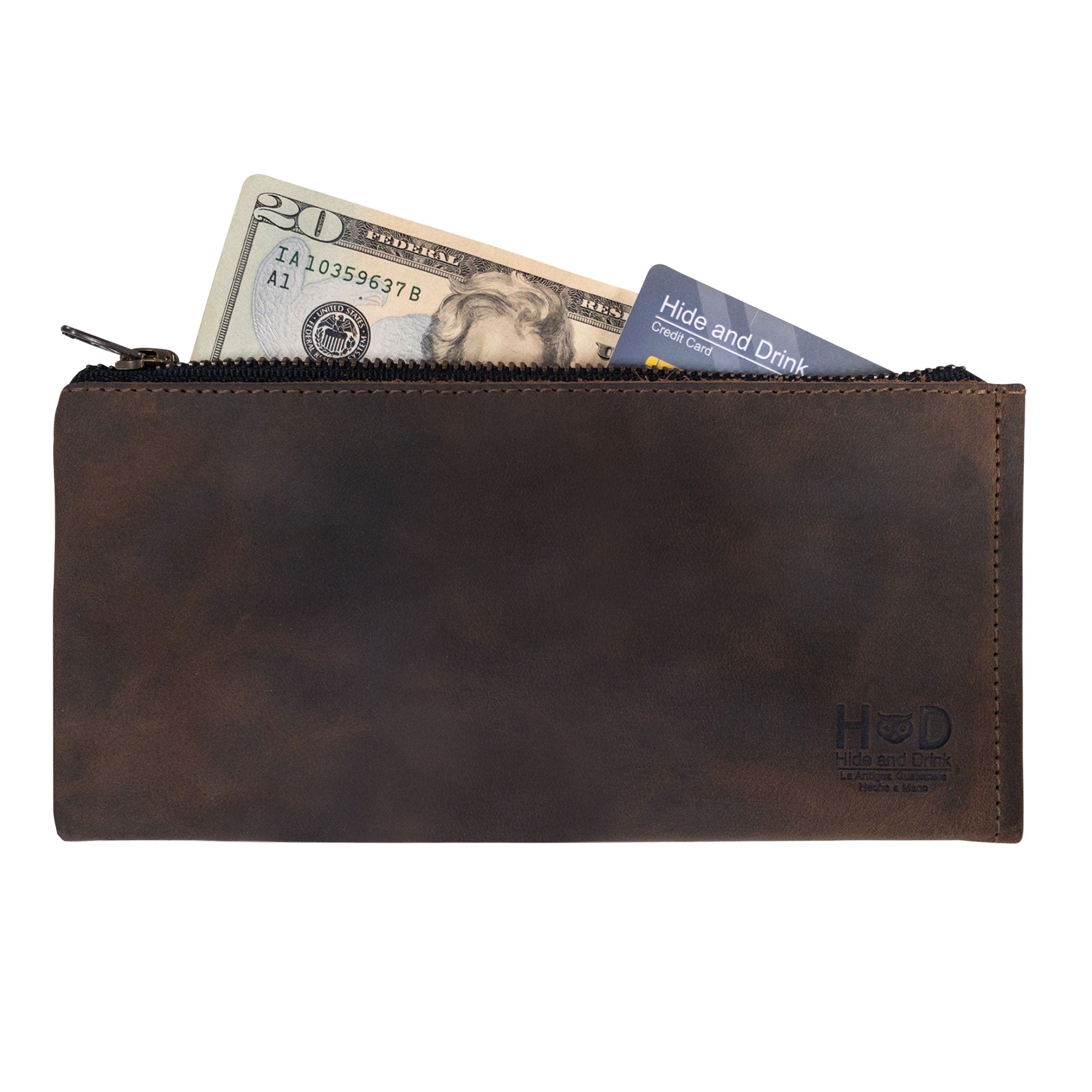 Hide & Drink Zipper Wallet showcasing a rustic design with cash and cards tucked inside. This Rectangular Wallet with Inner Card Slots is a zippered bag made from Full Grain Leather. A perfect Travel Accessory, it highlights the craftsmanship of stockyardX, featuring Small Batch Production, Hand Cut, Hand Sewn, Fire Branded quality. Handmade in La Antigua Guatemala & Oaxaca Mexico.