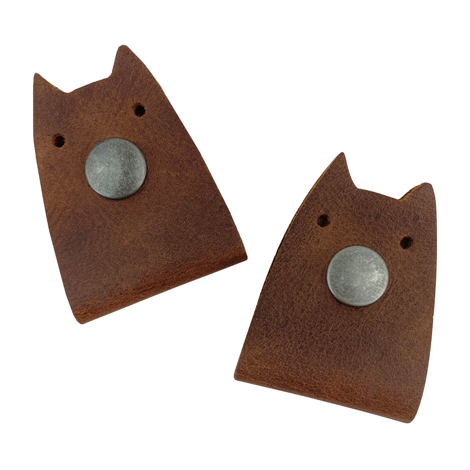 Taco Dog's Cat Cord Keeper (2 Pack) handmade from full grain leather. Cute and practical, this product helps wrap up your cables, earbuds, headphones, and chargers. Clip the snaps together for easy management and travel. Features artisan quality with small batch production, hand cut, hand sewn, and fire branded details, made in La Antigua Guatemala & Oaxaca Mexico.
