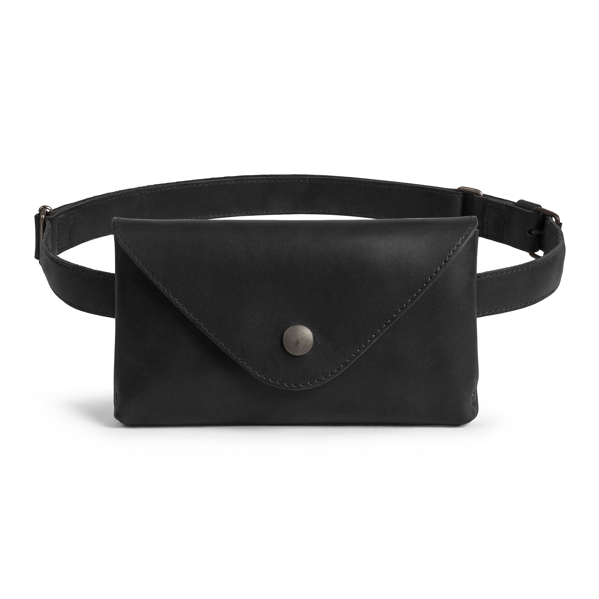 Stylish black version of Hide & Drink's Fancy Fanny Pack, showcasing premium craftsmanship in full grain leather. This fanny pack serves as a practical waist pouch and convenient phone holder. Handmade in La Antigua Guatemala, featuring artisan small batch production.