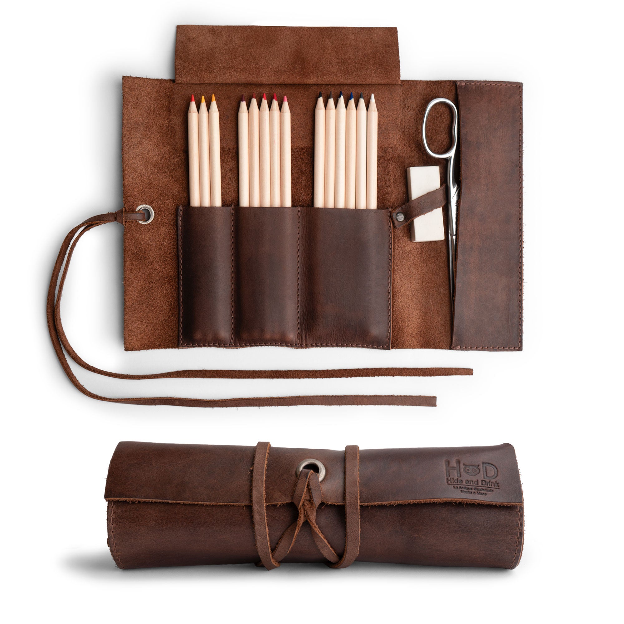 Hide & Drink Multi Purpose Pencil Roll showcasing multiple compartments for organized storage. Perfect for keeping crafting tools, scissors, and earphones neatly arranged. Crafted from Full Grain Leather, this rustic, handmade pencil roll pouch exemplifies small batch production and artisan quality, made in La Antigua Guatemala & Oaxaca Mexico.