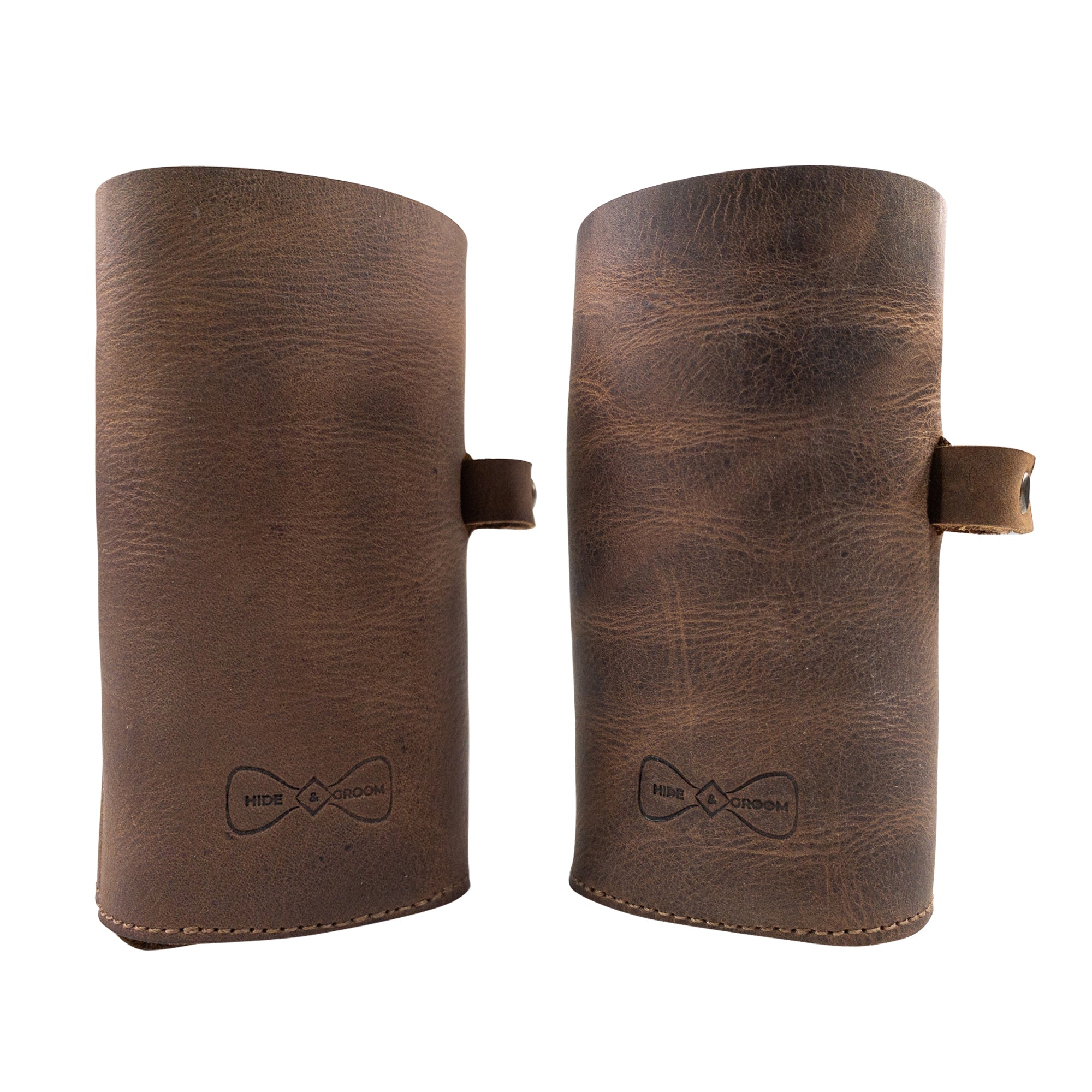 Hide & Groom Beer Bottle Sleeve Set of 2 showcases elegant full grain leather craftsmanship, featuring collapsible design and a bottle opener slot. Perfect for weddings, these rustic covers are handmade in La Antigua Guatemala. Ideal for Best Man accessories.