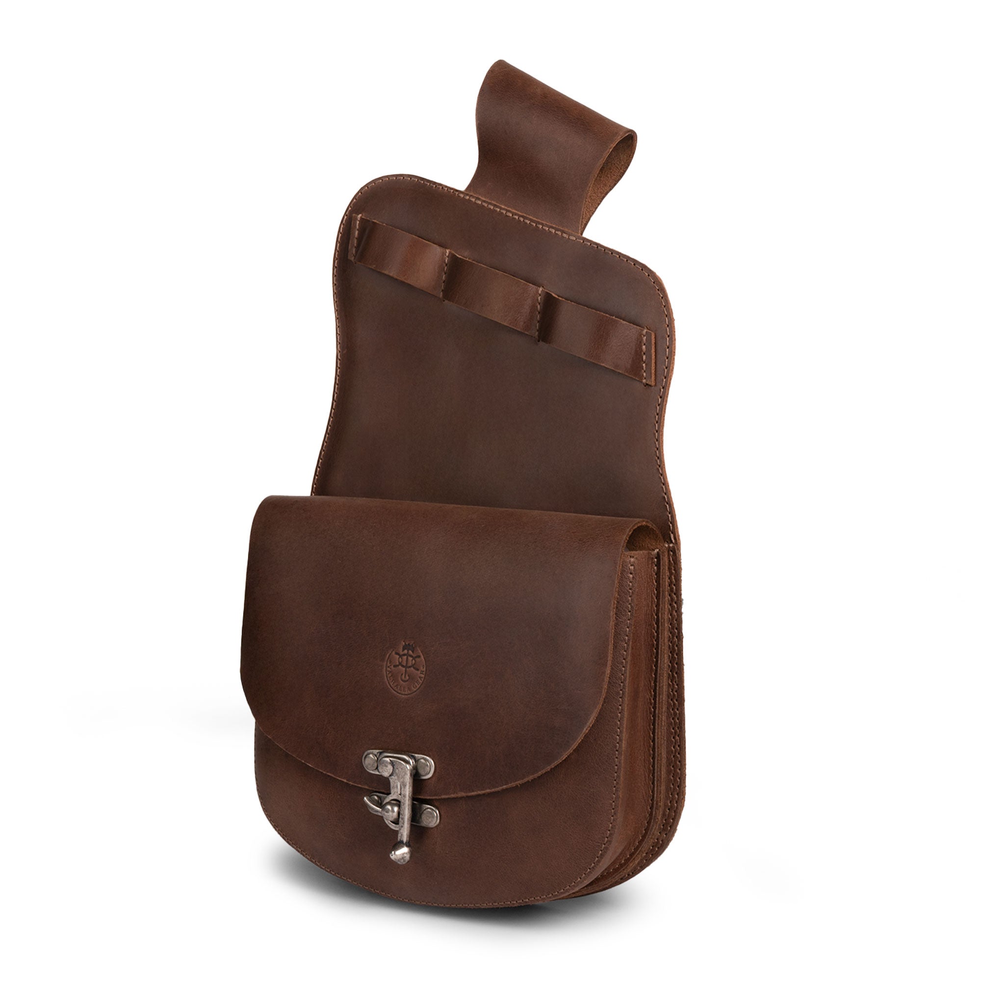 The Norseman, Hip Quiver by Valhalla Gear showcases a stylish design with a front pocket, perfect for archers. This full grain leather hip storage solution embodies artisan craftsmanship, ideal for holding arrows securely. Experience the quality of these handcrafted accessories, made in La Antigua Guatemala & Oaxaca Mexico, and elevate your archery sessions with this handmade practice bag.