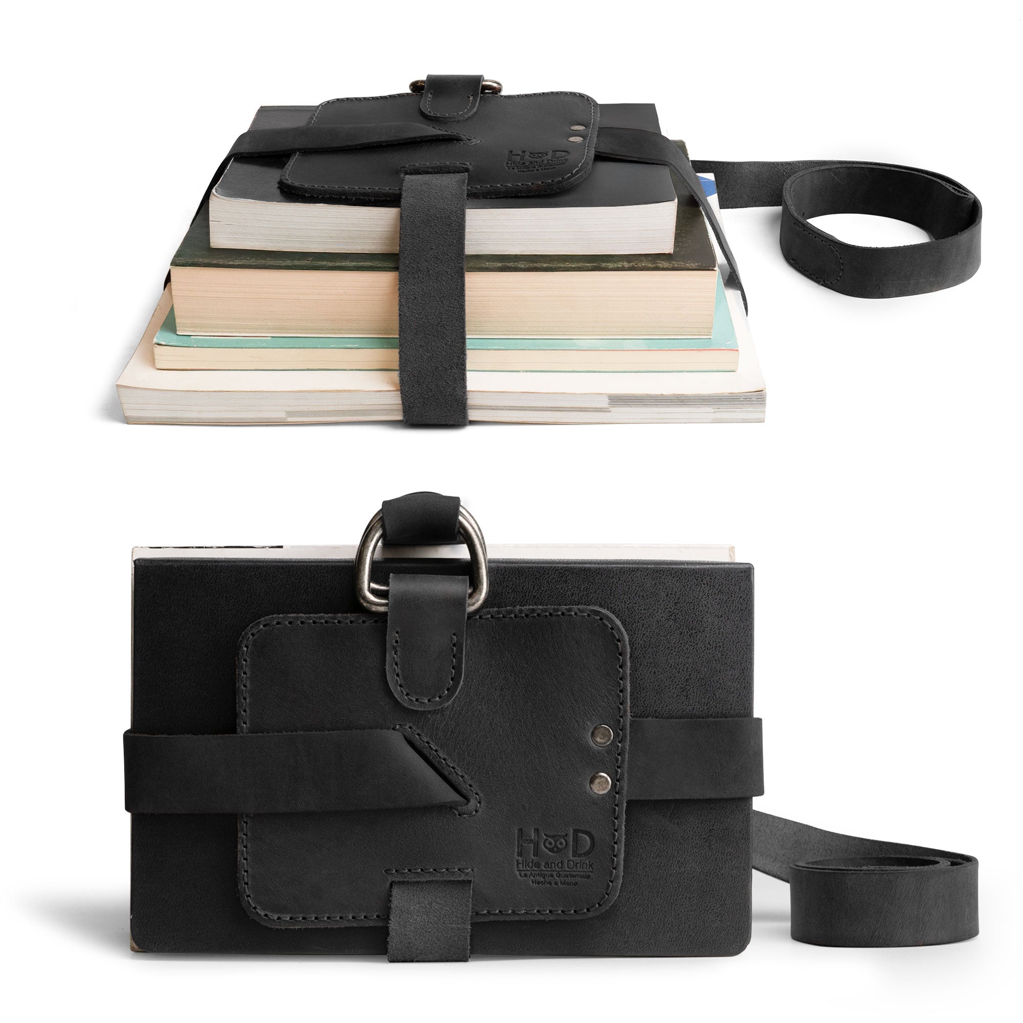 Hide & Drink Book Strap Carrier in use with books, showcasing its adjustable strap and practical design. This accessory is made from Full Grain Leather, an artisan creation from La Antigua Guatemala, perfect for stylish readers.