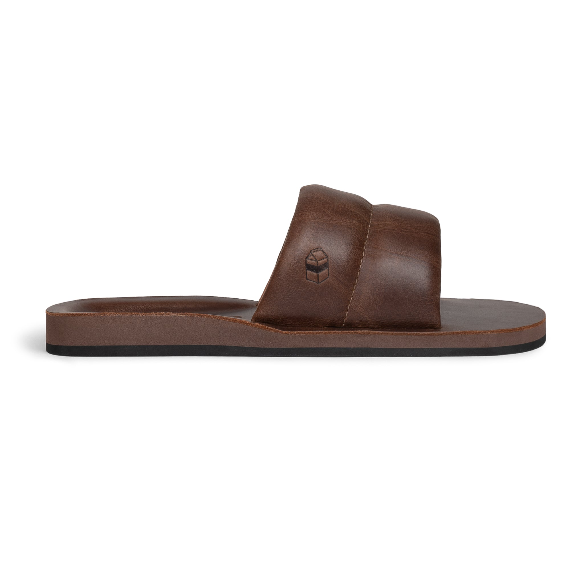 The Bayside Leather Slide from StockyardX showcases a rich brown color, highlighting its artisan craftsmanship with full grain leather. The bayside sandal features an open design that promotes comfort, making it perfect for casual wear. Handmade in La Antigua Guatemala & Oaxaca Mexico, it embodies small batch production and hand cut techniques.