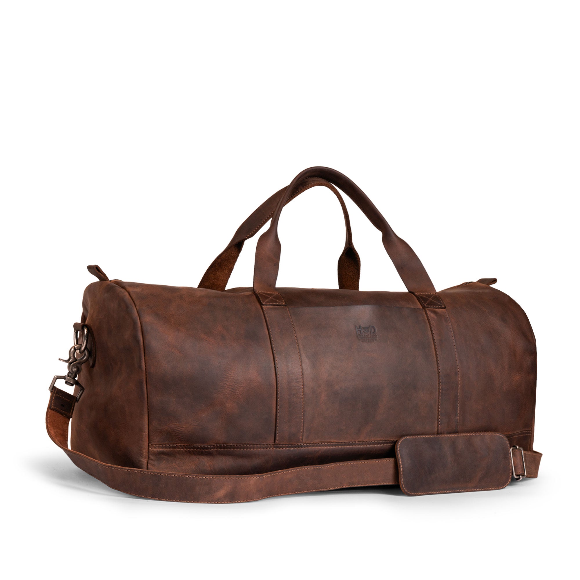 Hide & Drink Luggage Duffle Bag with Shoulder Strap showcased in rich Full Grain Leather, perfect for travel as an overnight bag, featuring artisan craftsmanship with hand cut and hand sewn details, handmade in La Antigua Guatemala & Oaxaca Mexico.