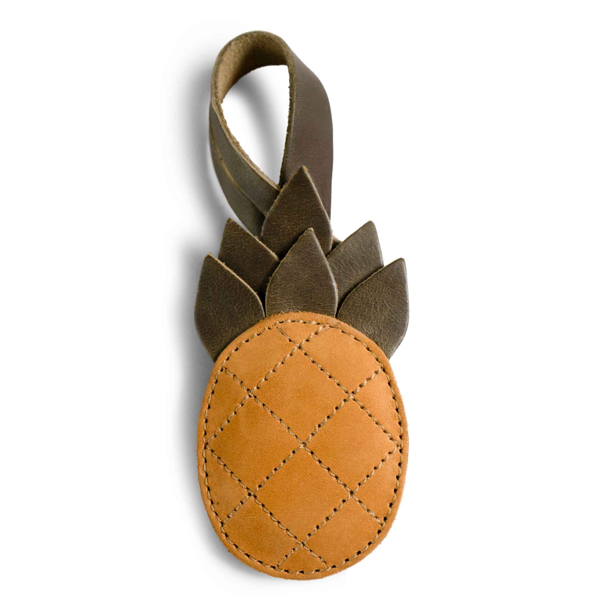 Hide & Drink Bag Charms featuring a trendy leaf design, making it an ideal charm for handbags. This purse charm for tote & backpacks is crafted from full grain leather, highlighting StockyardX's dedication to small batch production. Each piece showcases hand cut, hand sewn craftsmanship and fire branding, handmade in La Antigua Guatemala & Oaxaca Mexico.