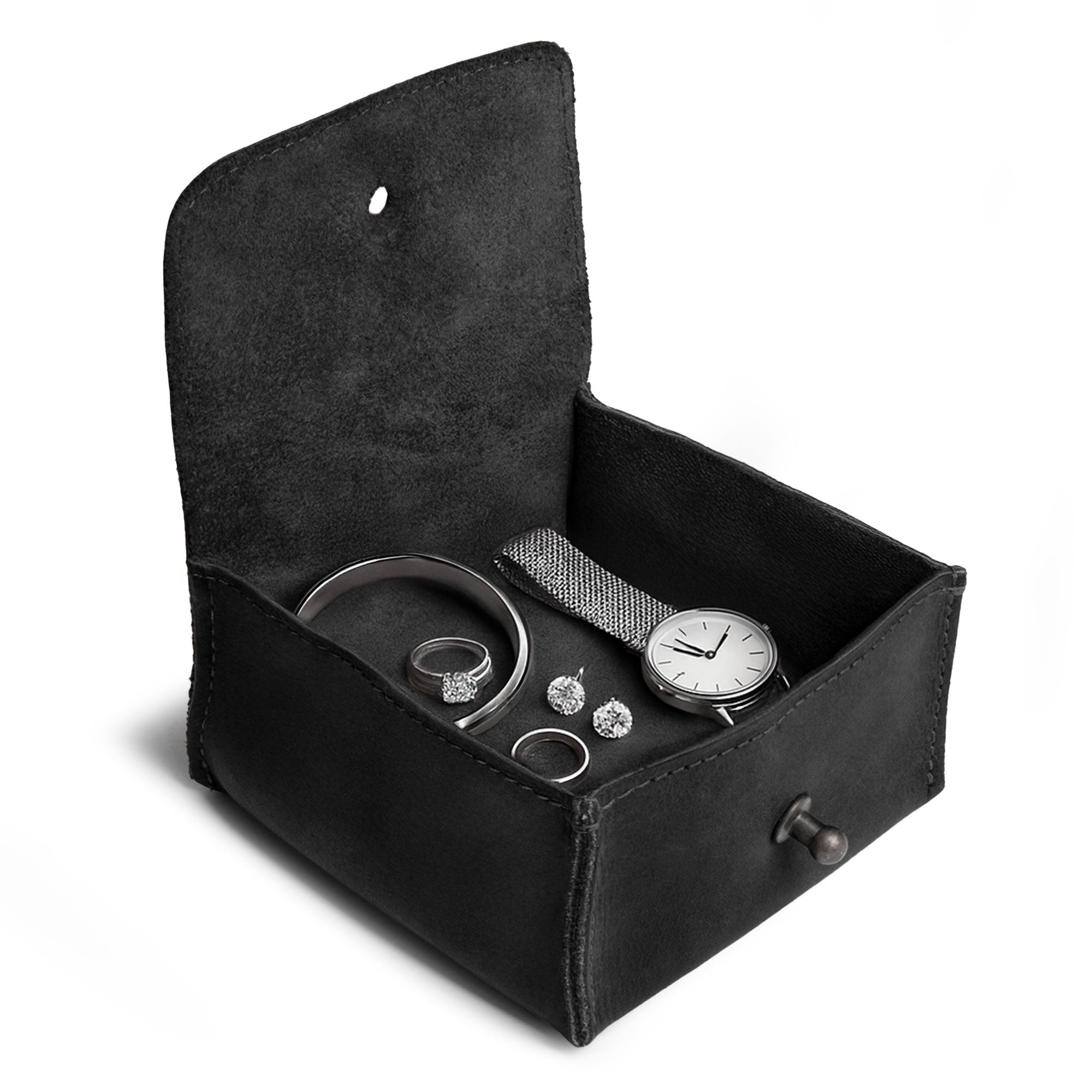 Interior shot of a Hide & Drink Jewelry Pouch with rings stored inside, designed for organized precious items. This artisan pouch captures the essence of upscale gifting for weddings.