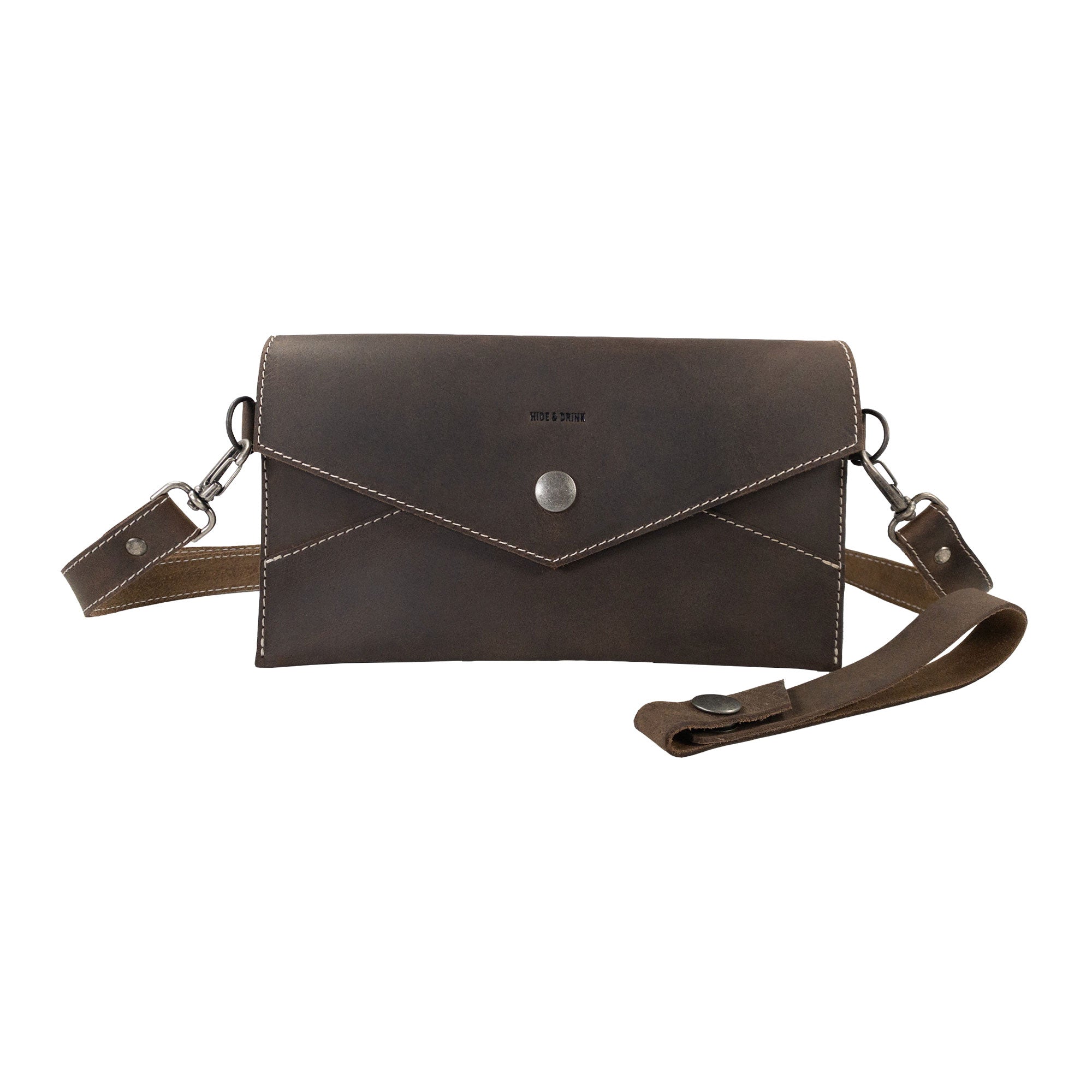 Stylish Convertible Envelope Bag by Hide & Drink, crafted from Full Grain Leather. This Envelope Crossbody Bag features a chic design made in small batch production, showcasing meticulous hand cut and hand sewn craftsmanship by artisans in La Antigua Guatemala & Oaxaca Mexico.