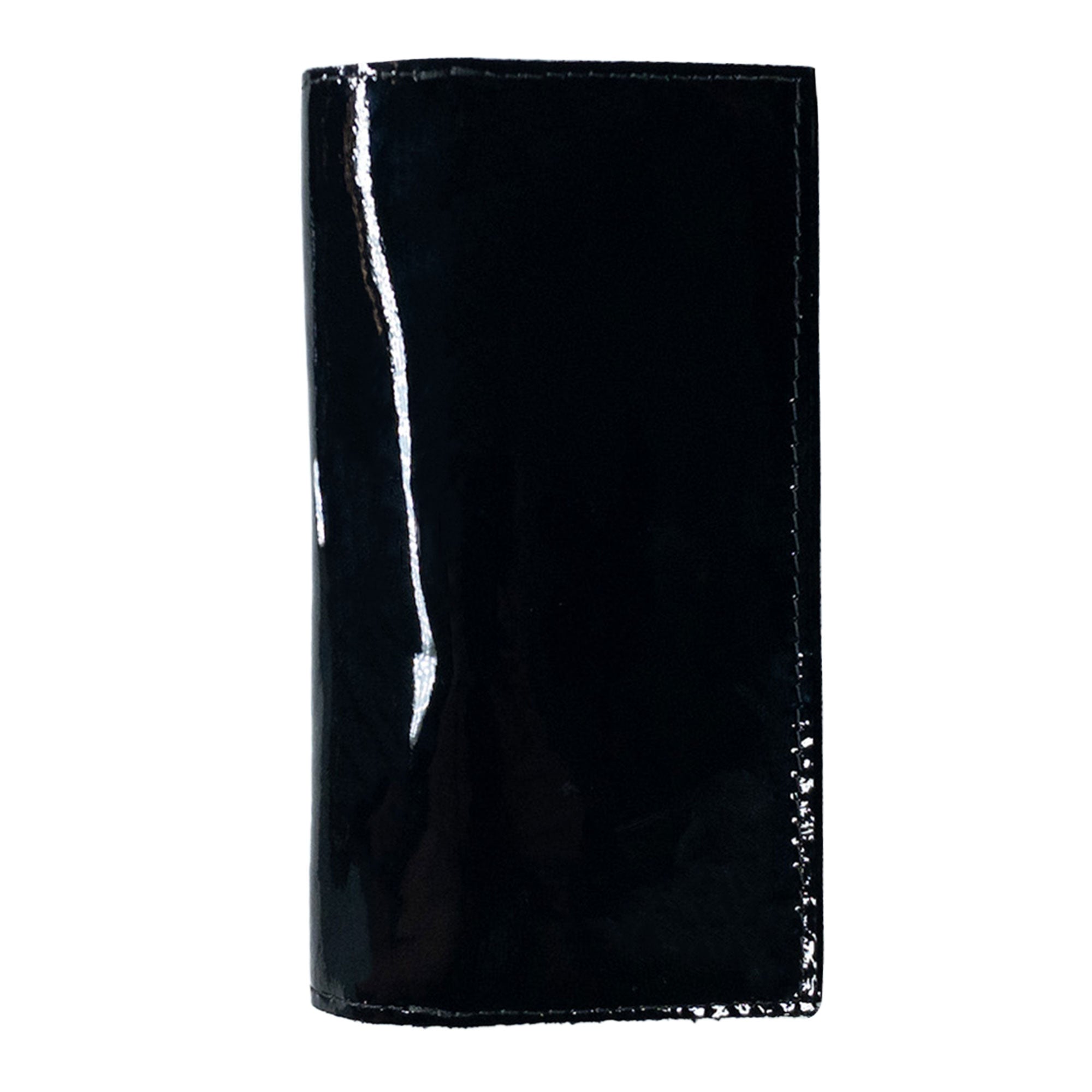 Checkbook Leather Cover by Hide & Drink presented in a chic style, ideal as a minimalist organizer for standard checkbooks. Highlighting artisan craftsmanship, this handmade item is made from full grain leather in La Antigua Guatemala and Oaxaca Mexico, showcasing small batch production.