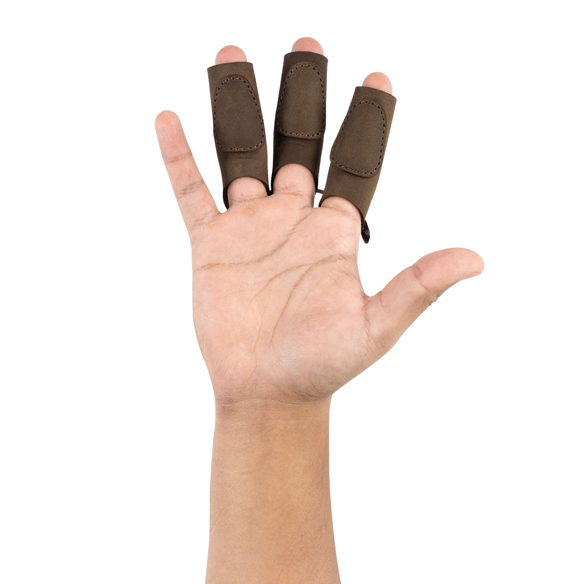 A hand wearing the Set of 3 Finger Protectors for Archery by Valhalla Gear. These finger guards are made from high-quality full grain leather, ideal for archer accessories, including recurve bow and shooting targeting. Perfect for cosplay enthusiasts, this artisanal product reflects small batch production with hand cut and hand sewn craftsmanship. Handmade in La Antigua Guatemala.