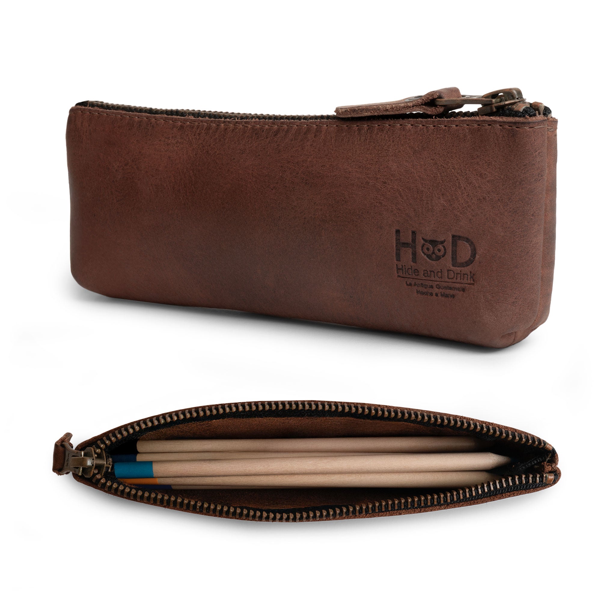 Side view of Hide & Drink's durable Pencil Pouch made from full grain leather. This rectangular pencil case serves as a stylish pen & marker pouch for men and women, featuring a flat zippered holder design. Handmade in La Antigua Guatemala & Oaxaca Mexico, it's an artisan piece from small batch production.