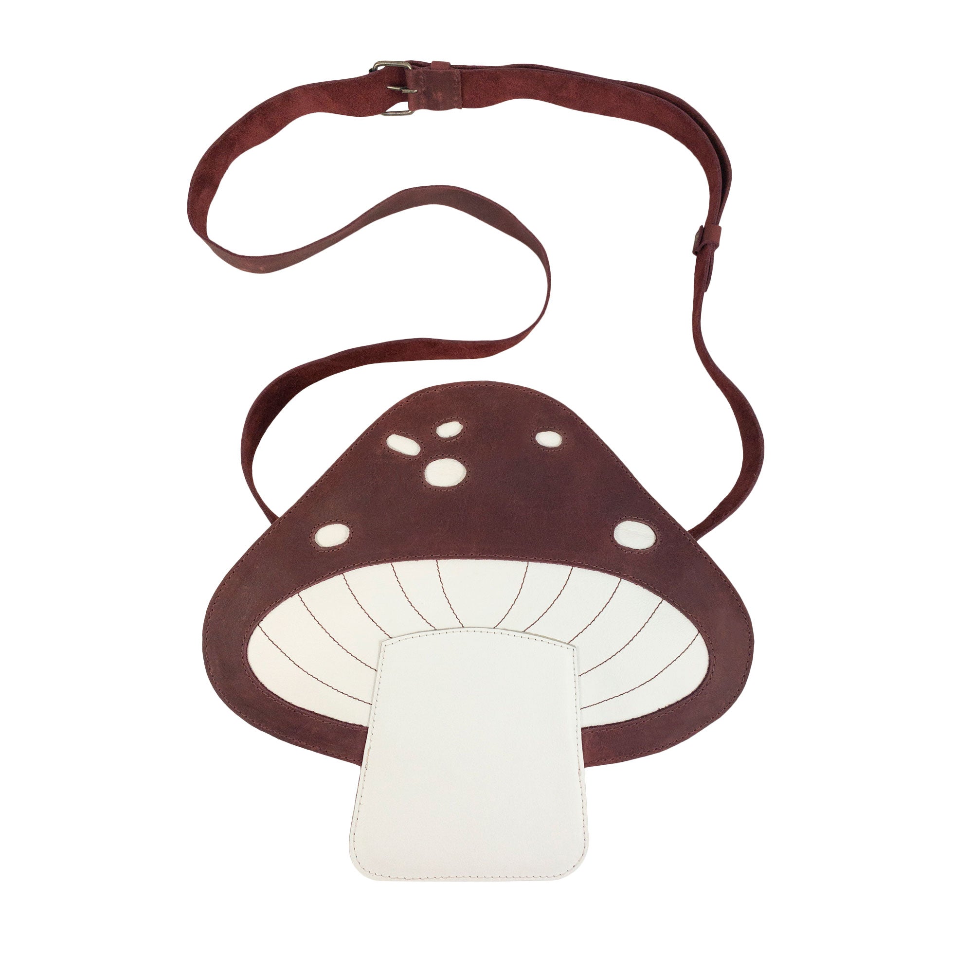 Mushroom-Shaped Leather Shoulder Bag by Tudi Frudi, featuring a whimsical design with an adjustable strap. This versatile crossbody bag is perfect for travel or as a messenger bag, crafted from Full Grain Leather, showcasing stockyardX's small batch production. Hand cut and sewn for quality, this artisan bag is handmade in La Antigua Guatemala.