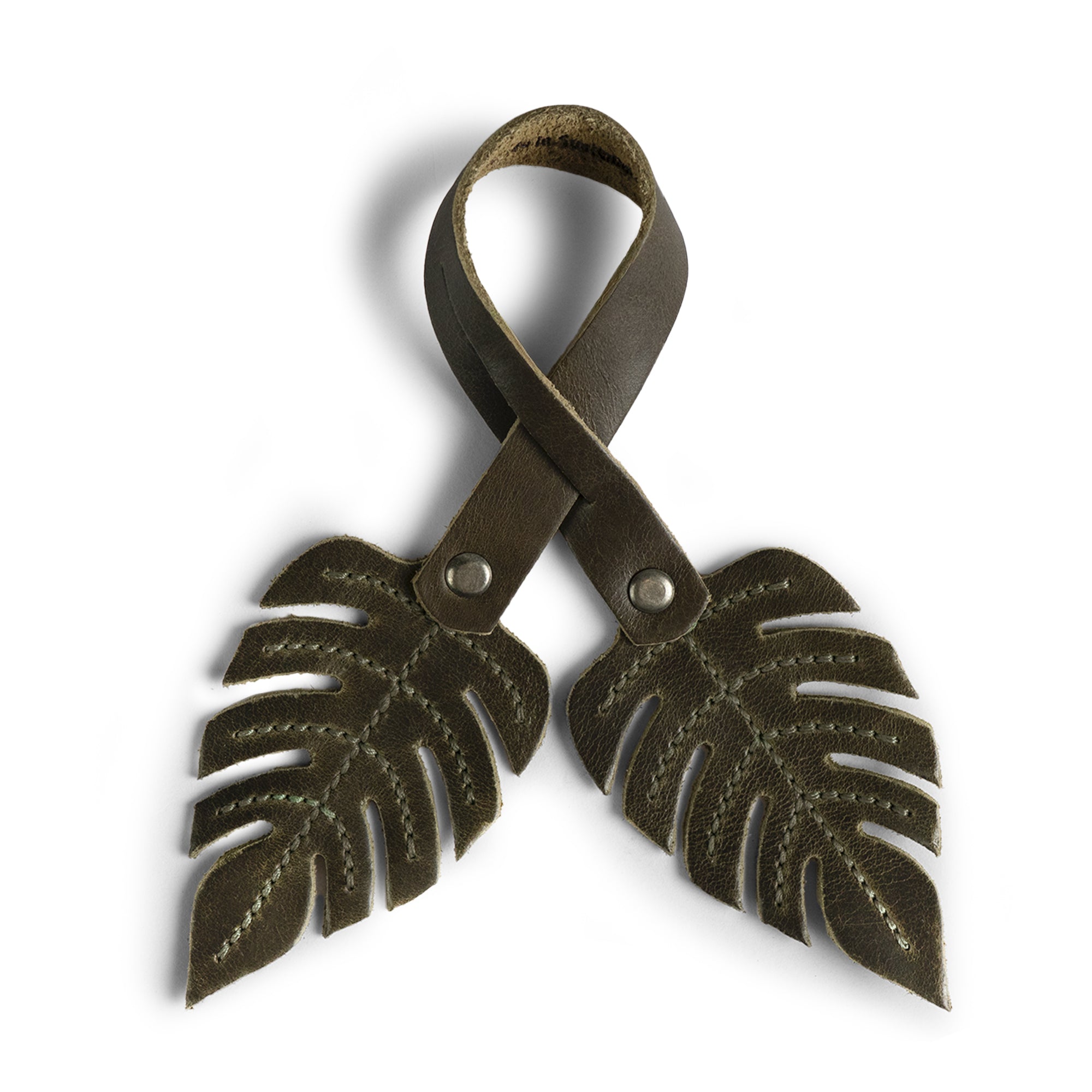 Hide & Drink Bag Charms featuring a playful bird design, the ideal charm for handbags. This purse charm for tote & backpacks is crafted from premium full grain leather, showcasing StockyardX's dedication to small batch production. Every piece represents meticulous hand cut, hand sewn craftsmanship along with fire branding, handmade in La Antigua Guatemala & Oaxaca Mexico.