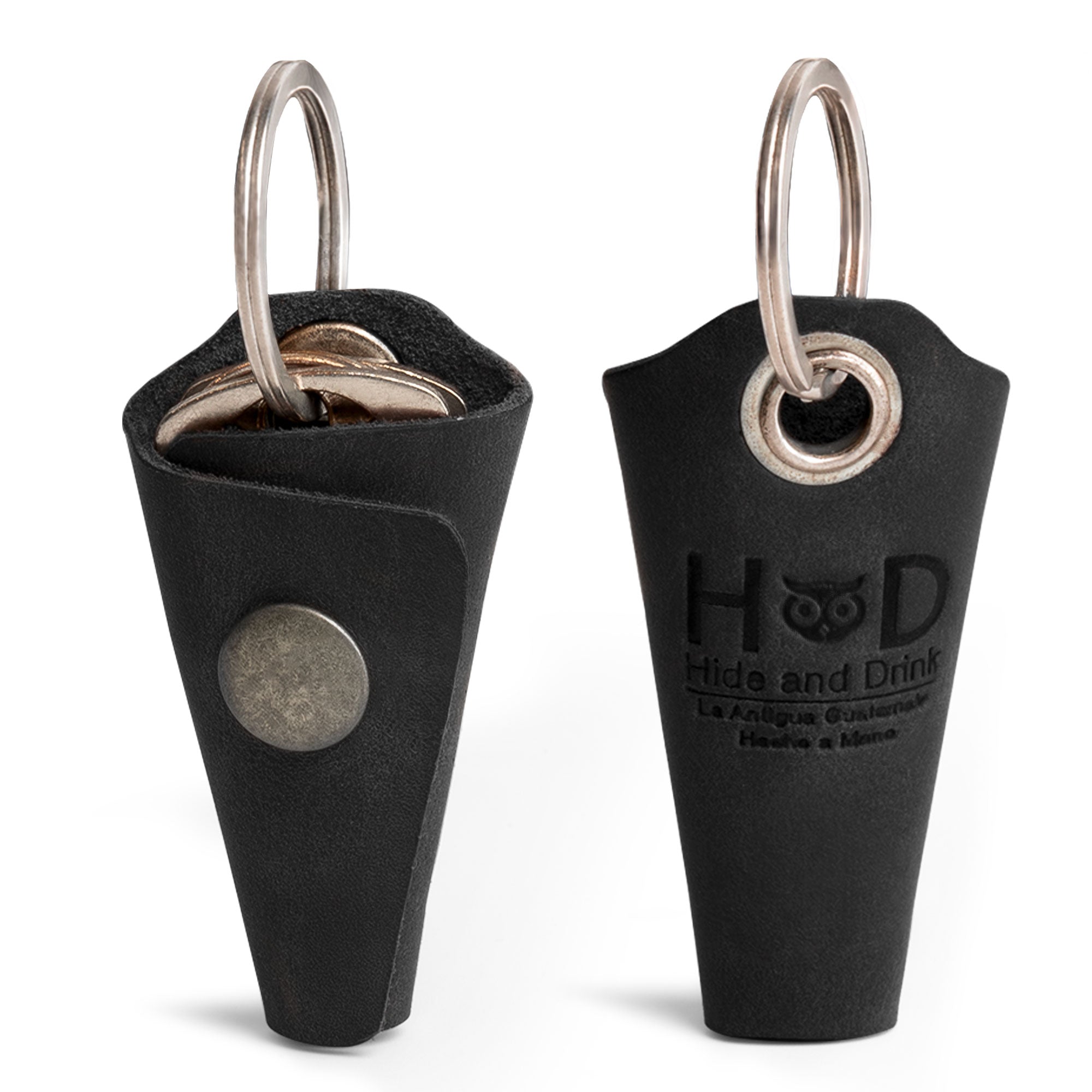 Elegant Wrap Keychain from Hide & Drink, crafted from durable full grain leather. This key ring cover features an organizer snap closure and functions as a silencer sleeve key holder for men. Equal parts stylish and practical, it showcases hand cut and hand sewn artisan craftsmanship, made in La Antigua Guatemala using small batch production.