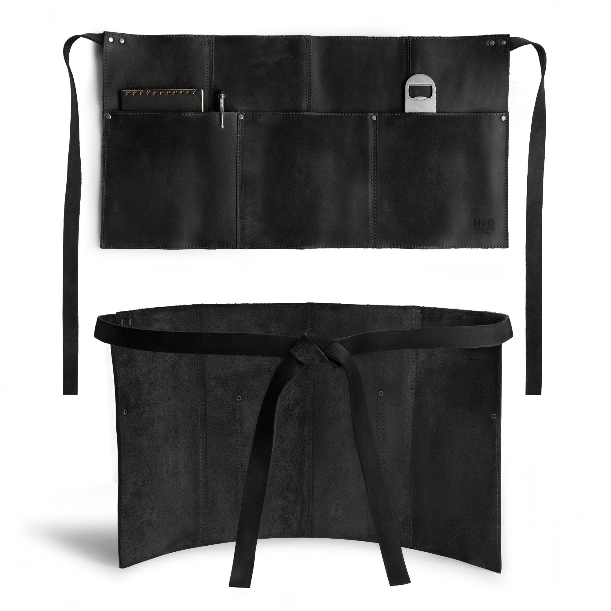 Hide & Drink Barista Leather Waist Apron displayed in black, featuring riveted pockets and designed for versatility as waitress and waiter accessories, crafted from full grain leather in small batch production in La Antigua Guatemala & Oaxaca Mexico.