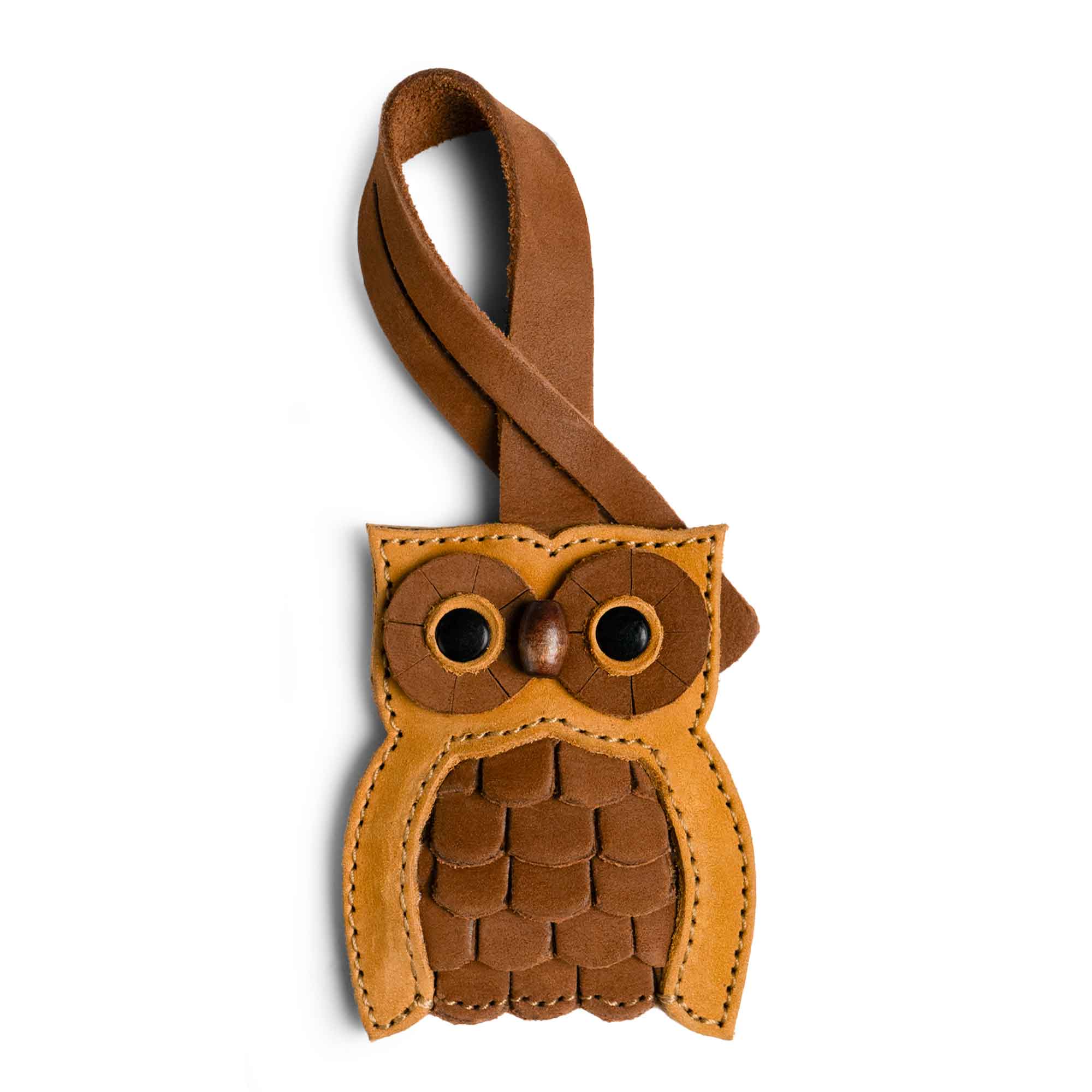 Hide & Drink Bag Charms showcasing a charming fox design, making it a delightful charm for handbags. This purse charm for tote & backpacks is crafted from high-quality full grain leather, reflecting StockyardX's focus on small batch production. Each piece exhibits hand cut, hand sewn craftsmanship with fire branding, handmade in La Antigua Guatemala & Oaxaca Mexico.