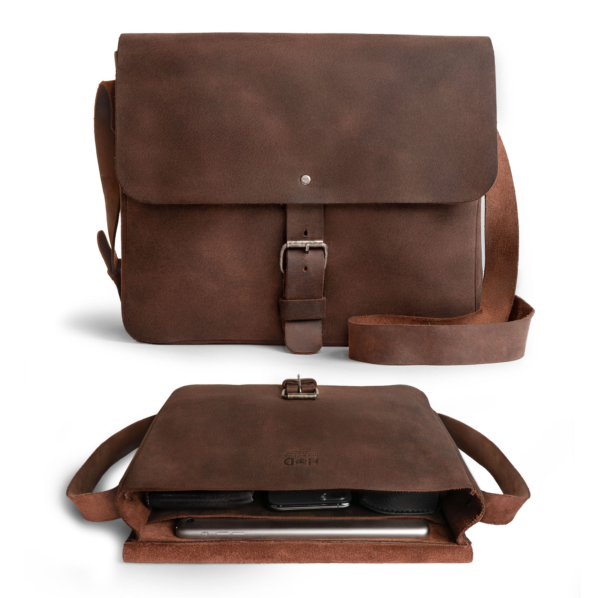 Hide & Drink’s Small Messenger Bag with tags, revealing its craftsmanship and origin. Made from high-quality Full Grain Leather, this durable crossbody bag represents a perfect travel accessory, artfully hand cut and sewn by artisans in La Antigua Guatemala & Oaxaca Mexico.