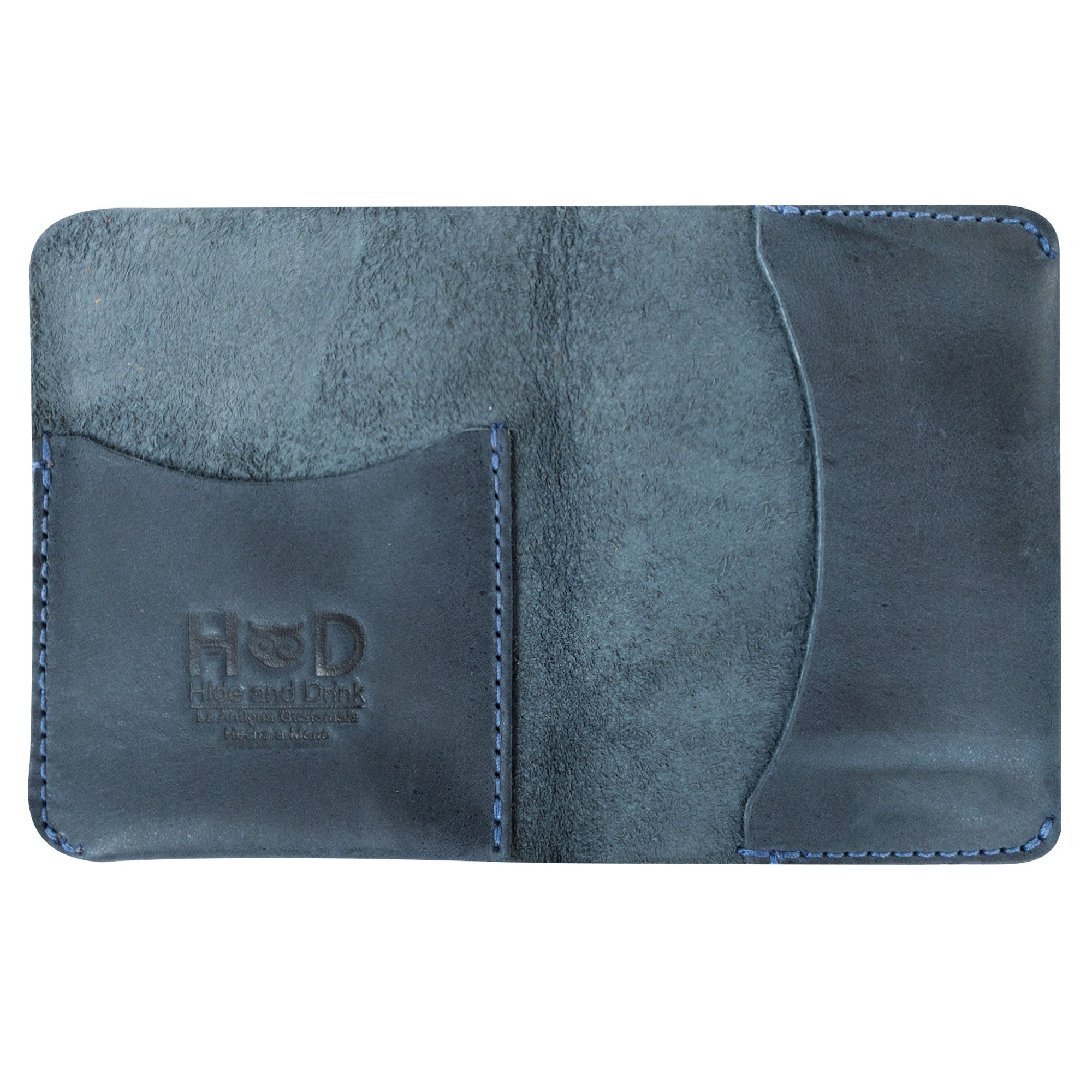 The Bifold Slim Card Holder by Hide & Drink displayed impressively on a rustic background. Ideal for credit card storage and cash organization, this minimalist wallet made from full grain leather epitomizes artisan craftsmanship, handmade in La Antigua Guatemala.