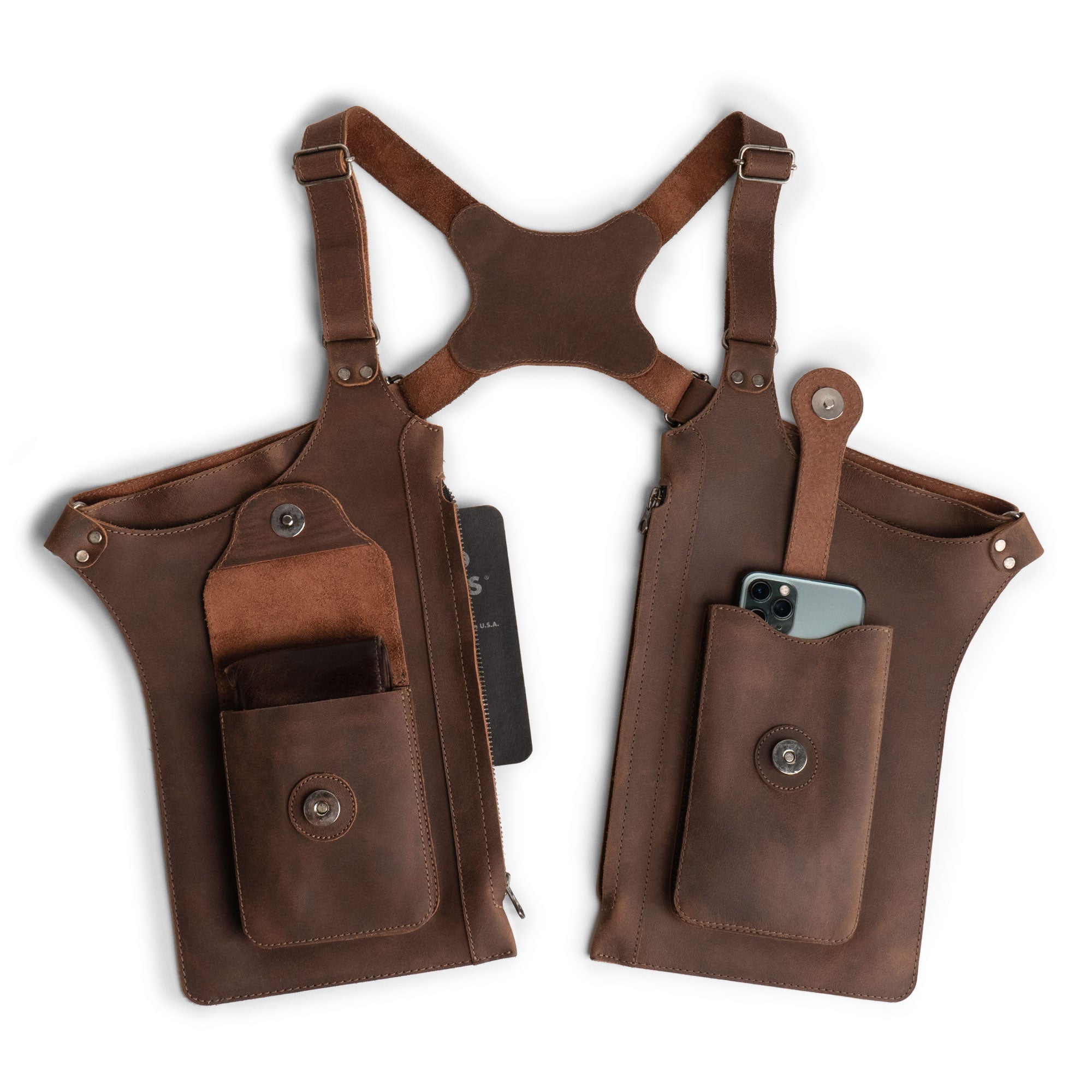 Hide & Play's Zippo Shoulder Holster showcases a vintage-inspired design featuring an adjustable harness with zippered-bags, perfect for cosplay, costume parties, or adding an edgy twist to your outfit. It is made from durable full grain leather, embodying artisan craftsmanship with small batch production, and handmade in La Antigua Guatemala & Oaxaca Mexico.