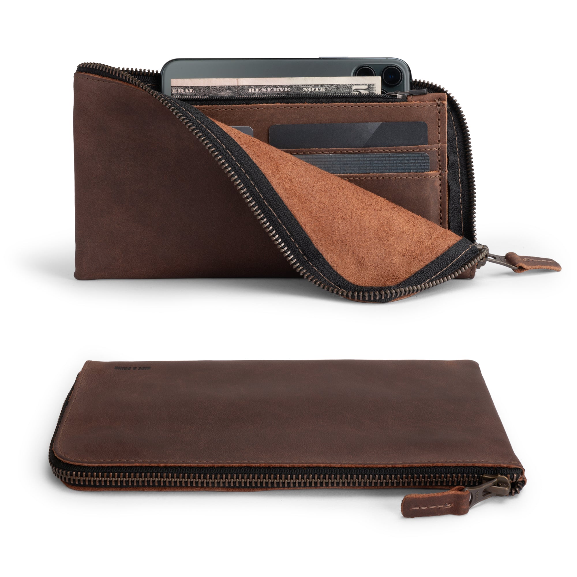 Open Large Zippered Wallet by Hide & Drink showcasing its interior with coins and credit cards, perfect for organizing your essentials. This Long Zippered Wallet for Men and Women serves as a Card Holder, Card Organizer, and Bill Holder, making it an essential Travel Accessory. Crafted from Full Grain Leather through small batch production, featuring hand cut and hand sewn details, it's a true artisan piece made in La Antigua Guatemala & Oaxaca Mexico.