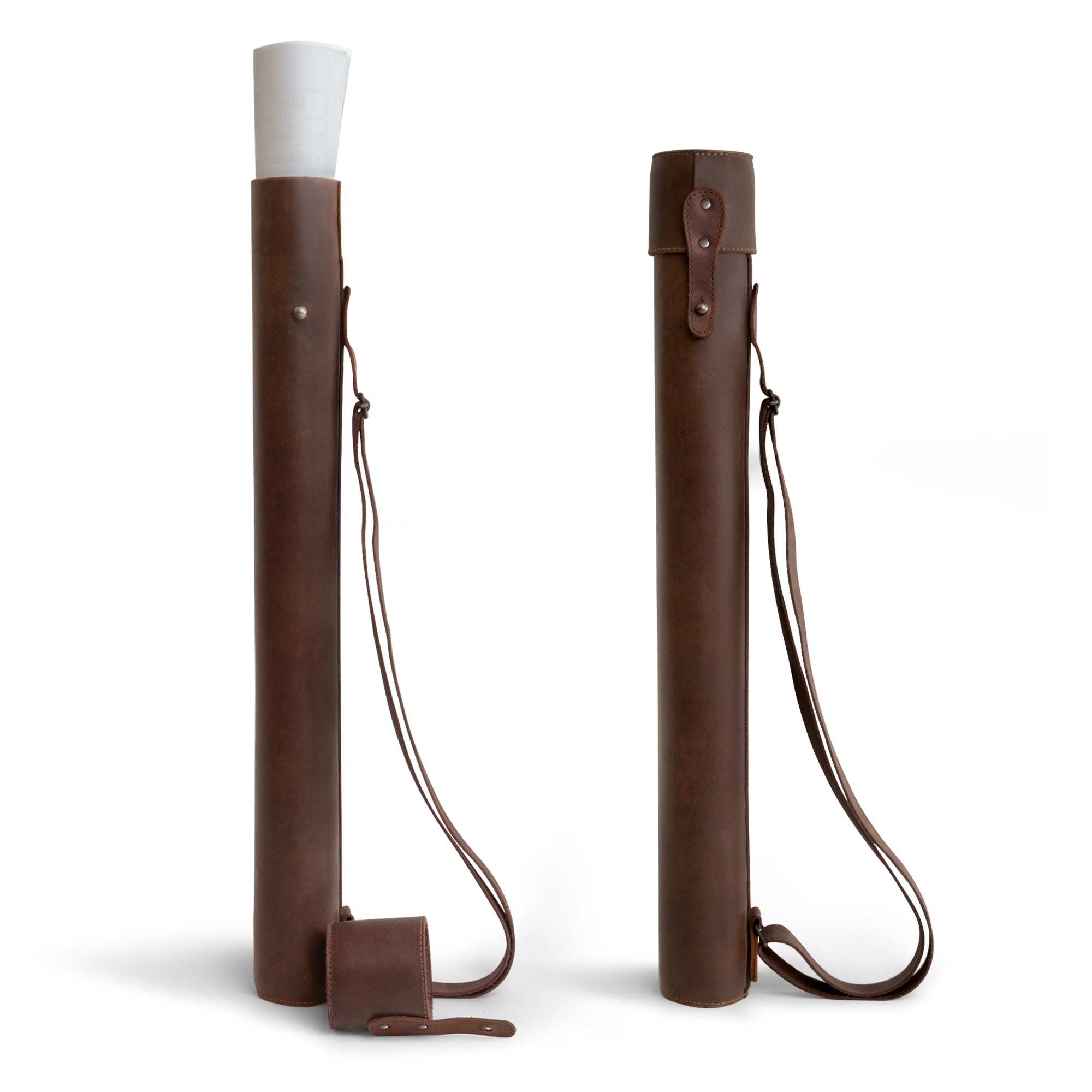 Hide & Drink's Blueprint Tube (A2 Paper Size), an Artisan-made document storage tube crafted from full grain leather, featuring an adjustable strap. Perfect for holding architectural drawings, this Blueprint Tube combines functionality with style, showcasing StockyardX's small batch production techniques and the handmade quality from La Antigua Guatemala & Oaxaca Mexico.