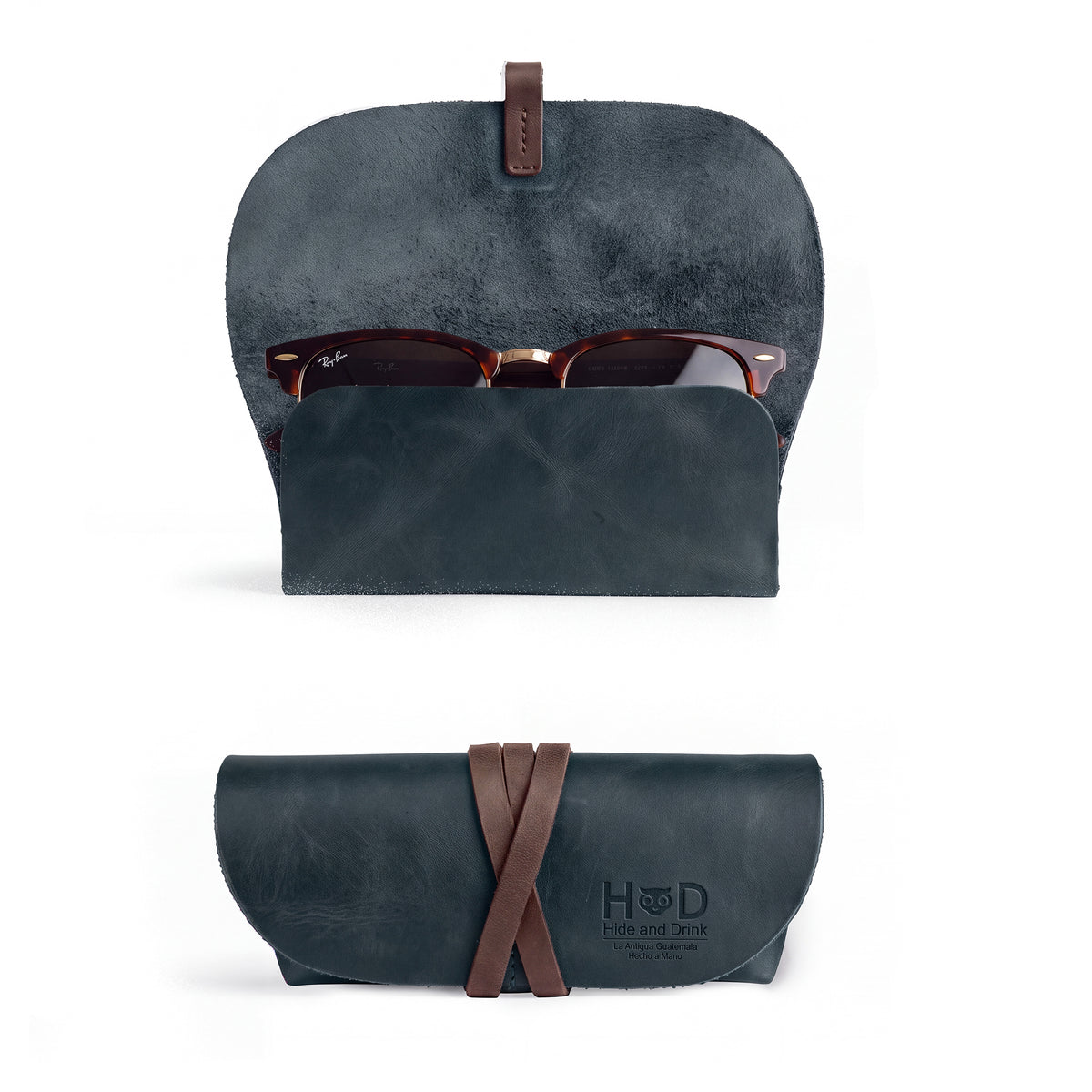 Hide & Drink Leather Sunglass Wrap, crafted from high-quality full grain leather, is perfect for on-the-go storage of your sunglasses. This artisan eye glasses storage is great for travel, hand cut and sewn in La Antigua Guatemala.