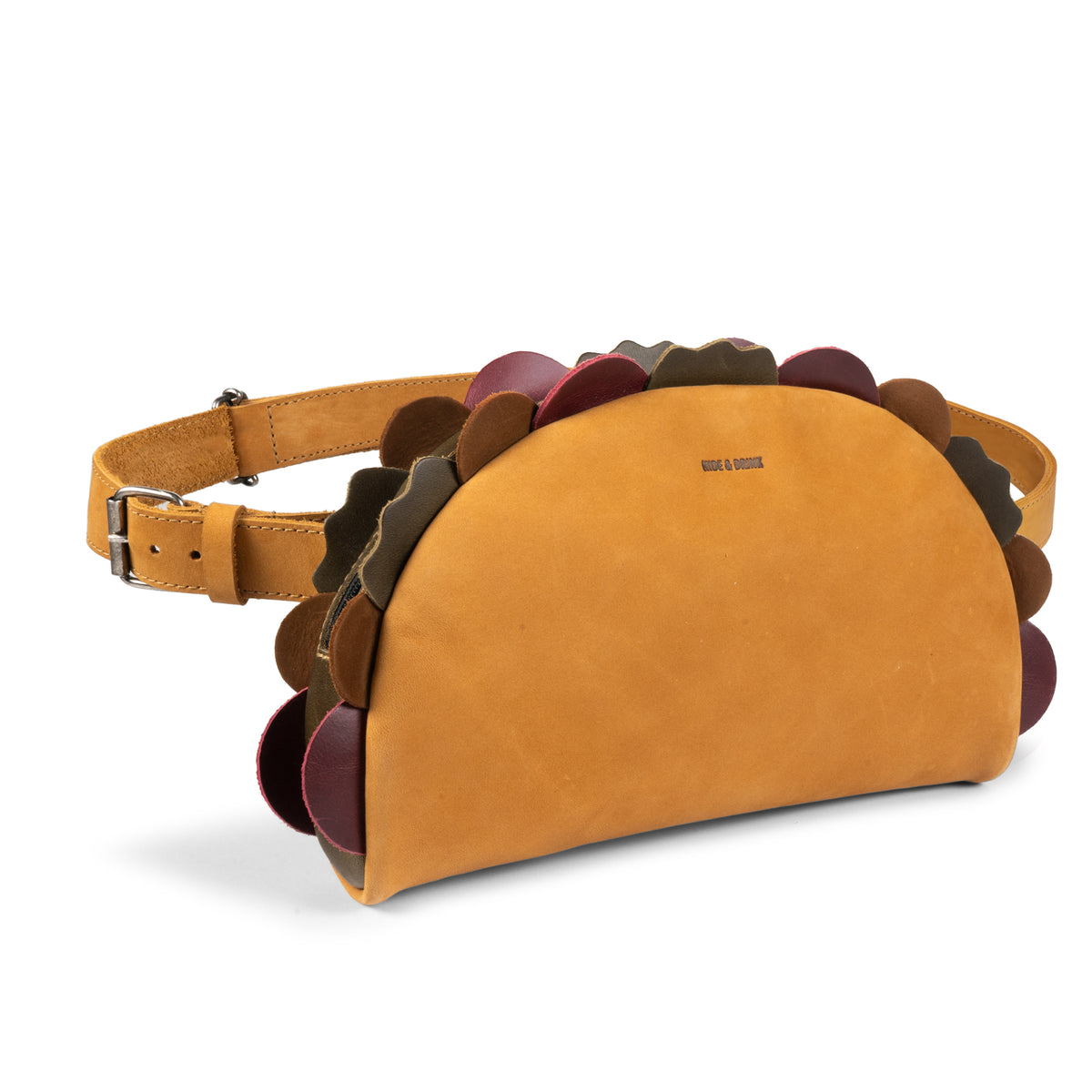 Hide & Drink Taco Fanny Pack shown from the front in tan full grain leather with colorful taco-inspired scalloped edges, a waist bag with a shoulder strap, fun belt bags style, zippered bags design, travel carrier, outdoor waist pouch, carry on case, and travel accessory. StockyardX small batch production is hand cut, hand sewn, fire branded, artisan made, and handmade in La Antigua Guatemala & Oaxaca Mexico.