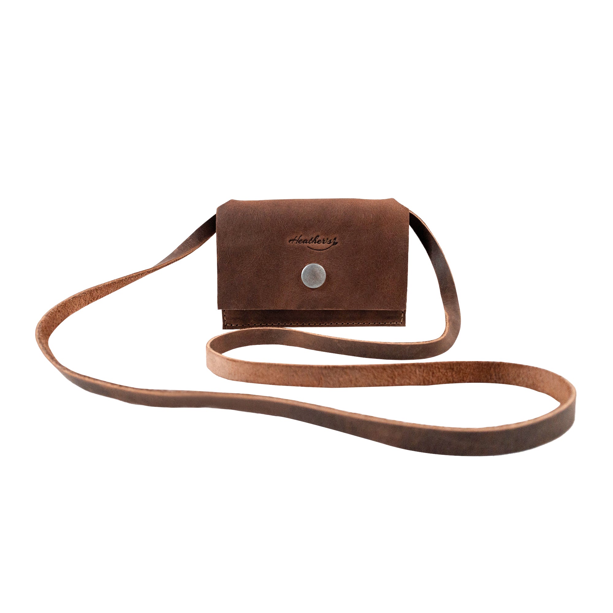 Heather's Mini Purse Wallet in stylish brown full grain leather with a strap, designed as a Mini Wallet Purse with Strap, ideal for cards, money organizer, and ID storage. This pocket pouch is perfect for daily use, showcasing small batch production and artisan craftsmanship, hand cut and sewn, fire branded, and handmade in La Antigua Guatemala.