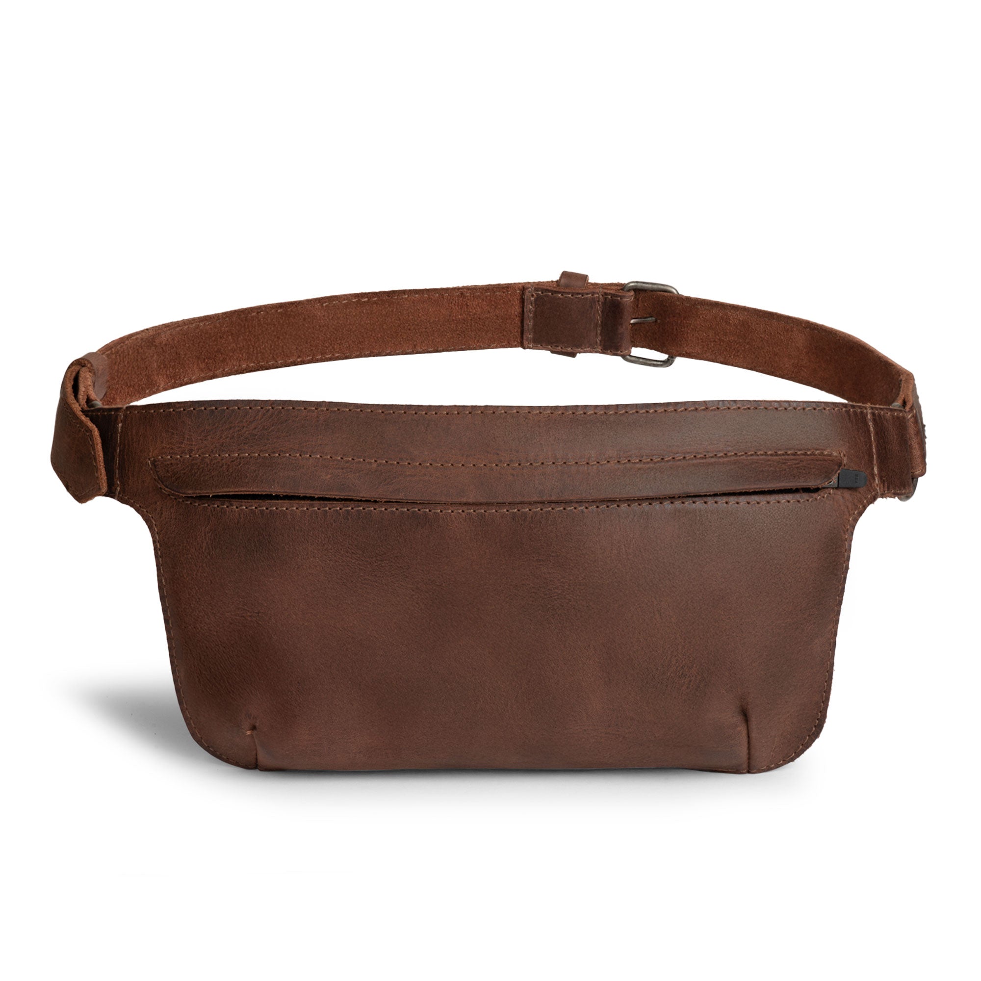 Slim Fanny Pack by Hide & Drink with a rich brown shade showcasing a rectangular design, perfect as a narrow waist bag with an adjustable strap, great for holding phones and small accessories. Made from premium full grain leather, this artisan piece is hand cut and sewn in La Antigua Guatemala.