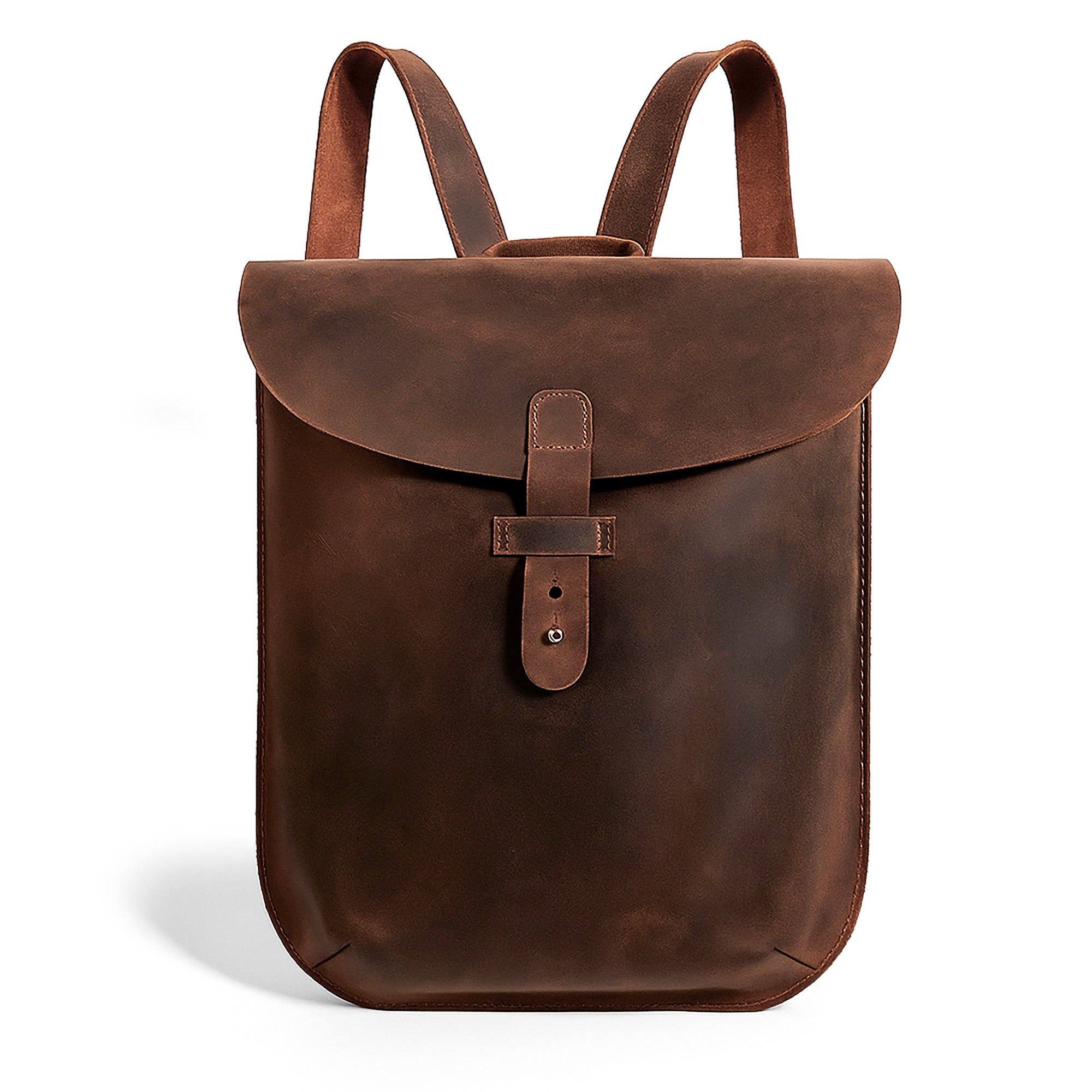 Hide & Drink's Rounded Laptop Backpack with Adjustable Straps presented in rich full grain leather. This stylish and durable portable case makes a perfect travel accessory. Handmade in La Antigua Guatemala & Oaxaca Mexico with attention to detail, featuring small batch production techniques. Ideal for those seeking a refined yet practical option.