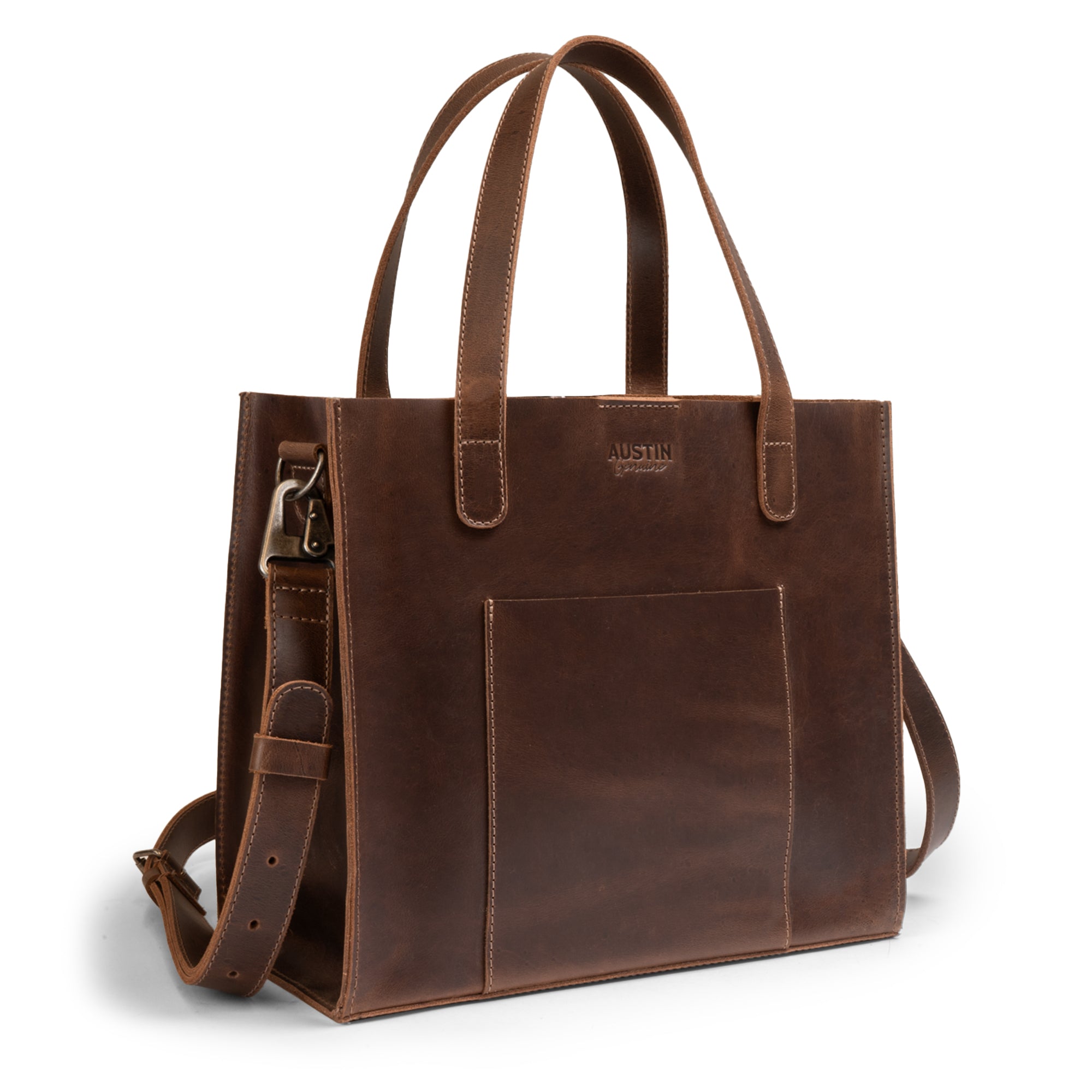 The Springdale Crossbody Tote by Austin Genuine, showcasing its elegant design in full grain leather, handcrafted with small batch production techniques in La Antigua Guatemala & Oaxaca Mexico. This artisan tote is perfect for carrying essentials while exuding style.