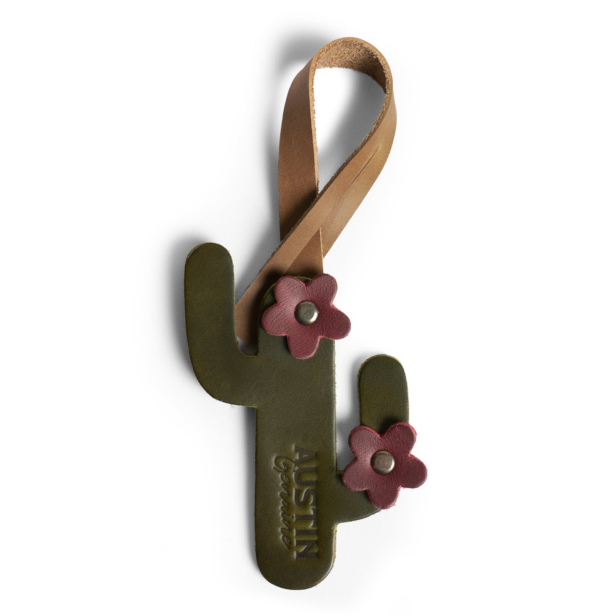 Bag Charms by Austin Genuine showcases a cactus bag charm with flowers. This Austin Genuine Bag Charm showcases 7 unique designs made with full grain leather from StockyardX, crafted through small batch production, hand cut, hand sewn, and fire branded, artisan, handmade in La Antigua Guatemala & Oaxaca Mexico.