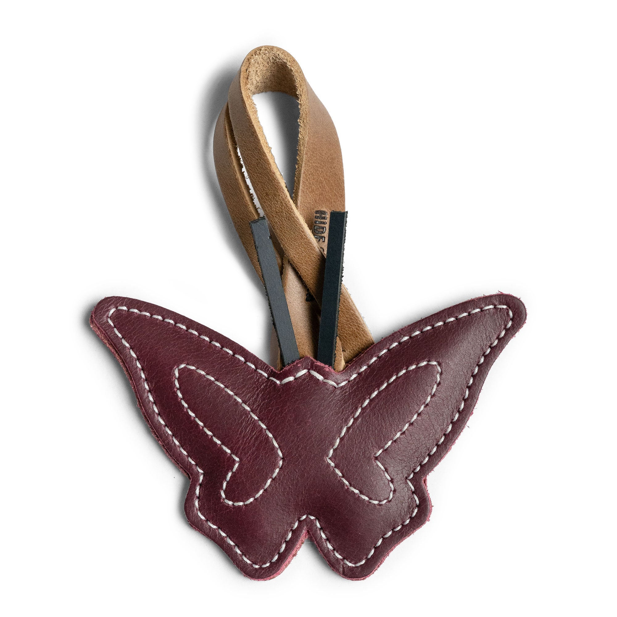 Hide & Drink Bag Charms featuring a delightful penguin design, making it an ideal charm for handbags. This purse charm for tote & backpacks is crafted from high-quality full grain leather, showcasing StockyardX's focus on small batch production. Each piece represents meticulous hand cut, hand sewn craftsmanship and fire branding, handmade in La Antigua Guatemala & Oaxaca Mexico.