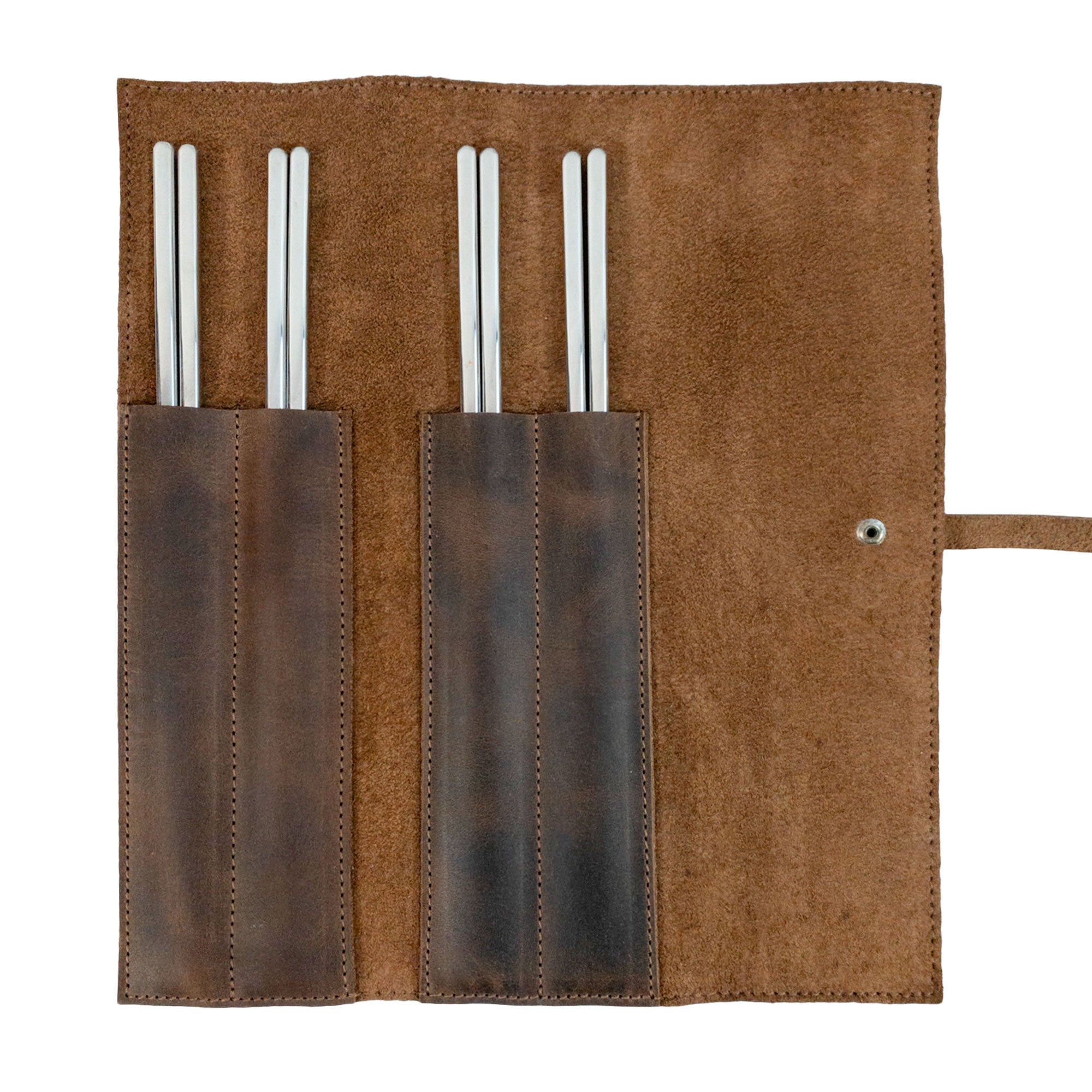 Open Rustic Roll Bag for Chopsticks showcasing compartments for bamboo wooden chopsticks, handmade by Cast Leather Co. This exquisite case features full grain leather and is perfect for keeping utensils organized, ideal for picnics or dining out. Rustic Roll Bag for Chopsticks, Rustic Roll for Chopsticks, Case for Bamboo Wooden Chopsticks, Kitchen Organizer, Full Grain Leather, StockyardX, Small Batch Production, Hand Cut, Hand Sewn, Fire Branded, Artisan, Handmade in La Antigua Guatemala & Oaxaca Mexico.