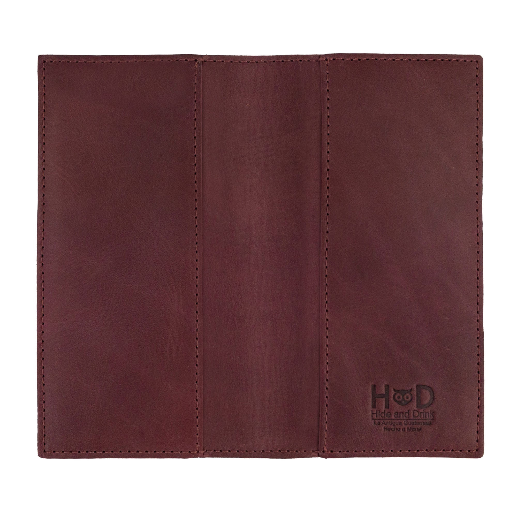 Checkbook Leather Cover by Hide & Drink showcasing its vibrant design as a minimalist organizer for standard checkbooks. This artisan piece, made from full grain leather, is handmade in La Antigua Guatemala and Oaxaca Mexico, emphasizing the tradition of small batch production.