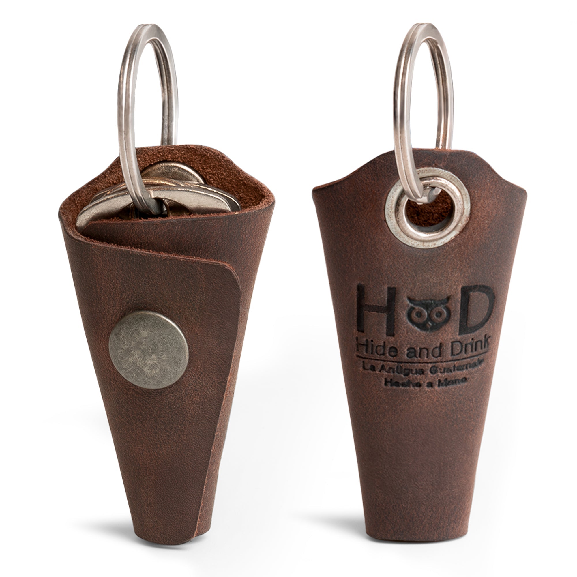 Stylish Wrap Keychain by Hide & Drink, made from full grain leather. This artisan-crafted key ring cover features an organizer snap closure and serves as a silencer sleeve key holder for men. Proudly handmade in La Antigua Guatemala with small batch production techniques, this hand cut and hand sewn item showcases exceptional craftsmanship.