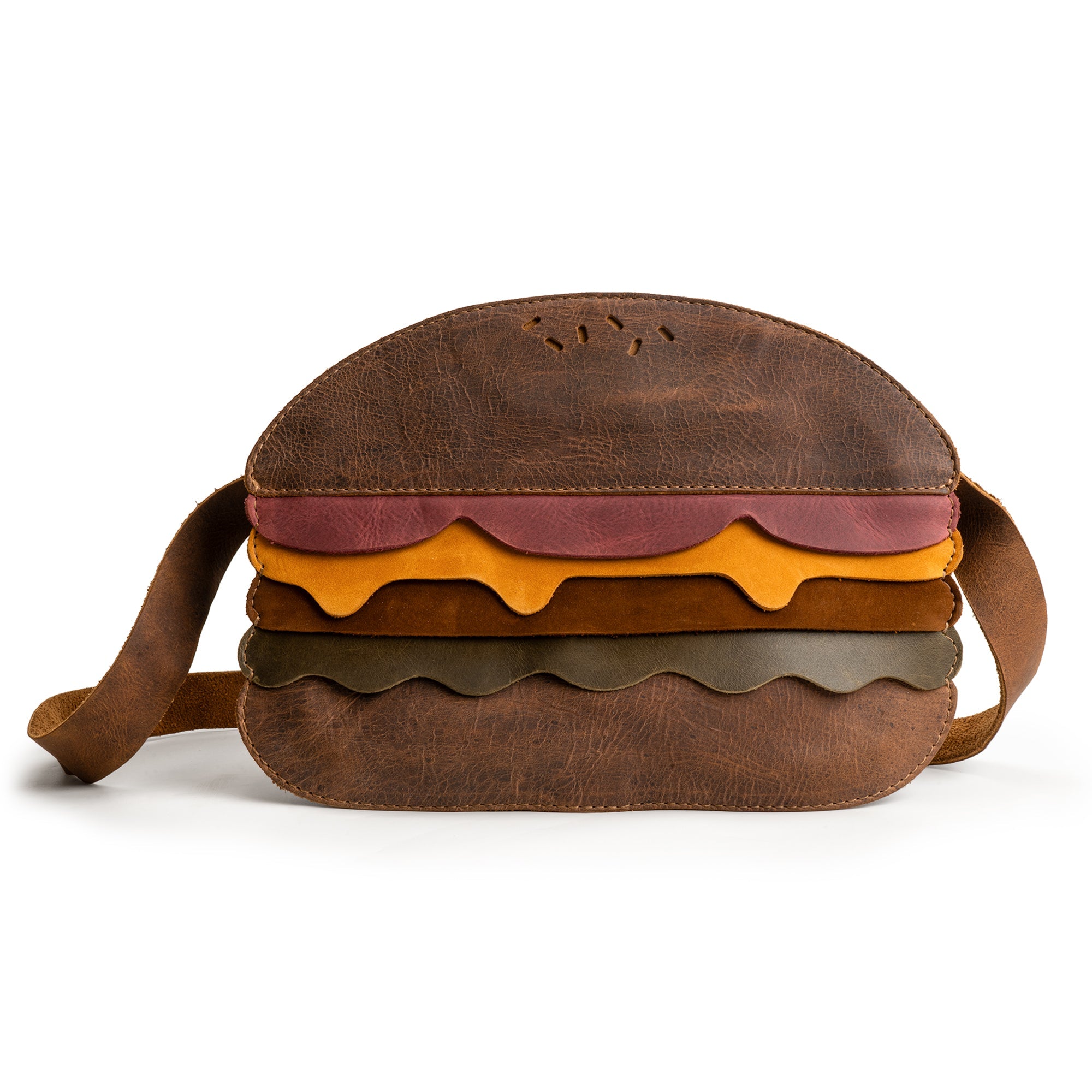 Stylish Burger-Shaped Shoulder Bag featuring vibrant layers, crafted by Tudi Frudi. This unique bag is perfect for adding a fun touch to your outfit while being a practical Travel Accessory. Enjoy its Full Grain Leather texture in this small batch production item, handmade in La Antigua Guatemala & Oaxaca Mexico. Ideal as a Crossbody Bag or Messenger Bag, it's both eye-catching and functional.