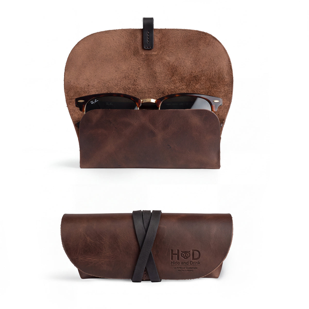 Hide & Drink Leather Sunglass Wrap features a slim design perfect for storing your eyewear. Handmade in La Antigua Guatemala from full grain leather, this stylish sunglass wrap ensures protection from scratches. Ideal for travel, it is artisan crafted, hand cut, and hand sewn for durability.